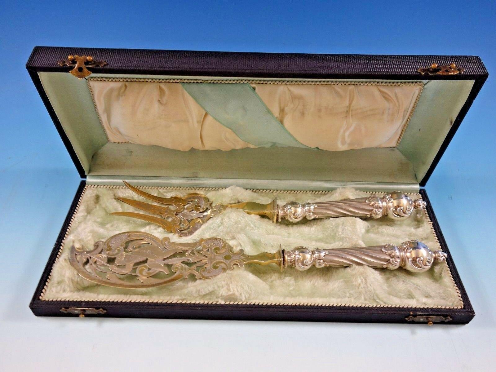 European Art silver

Gorgeous European .800 art silver fish serving set, 2-piece, with large bulbous column-like silver handles and partial gilt silver plate blades and tines. The knife measures 11 3/8