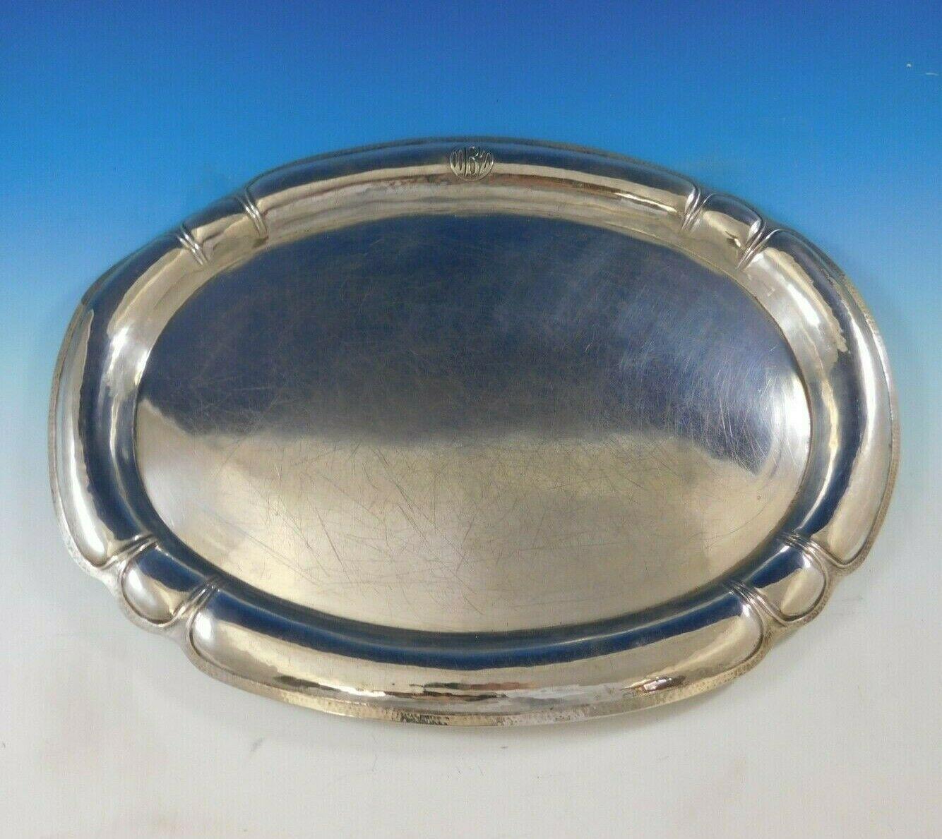 Art silver shop

Beautiful art silver shop sterling silver oval tea tray with hand hammered detail. It is handmade Chicago Arts & Crafts silver. This piece measures 20 1/2