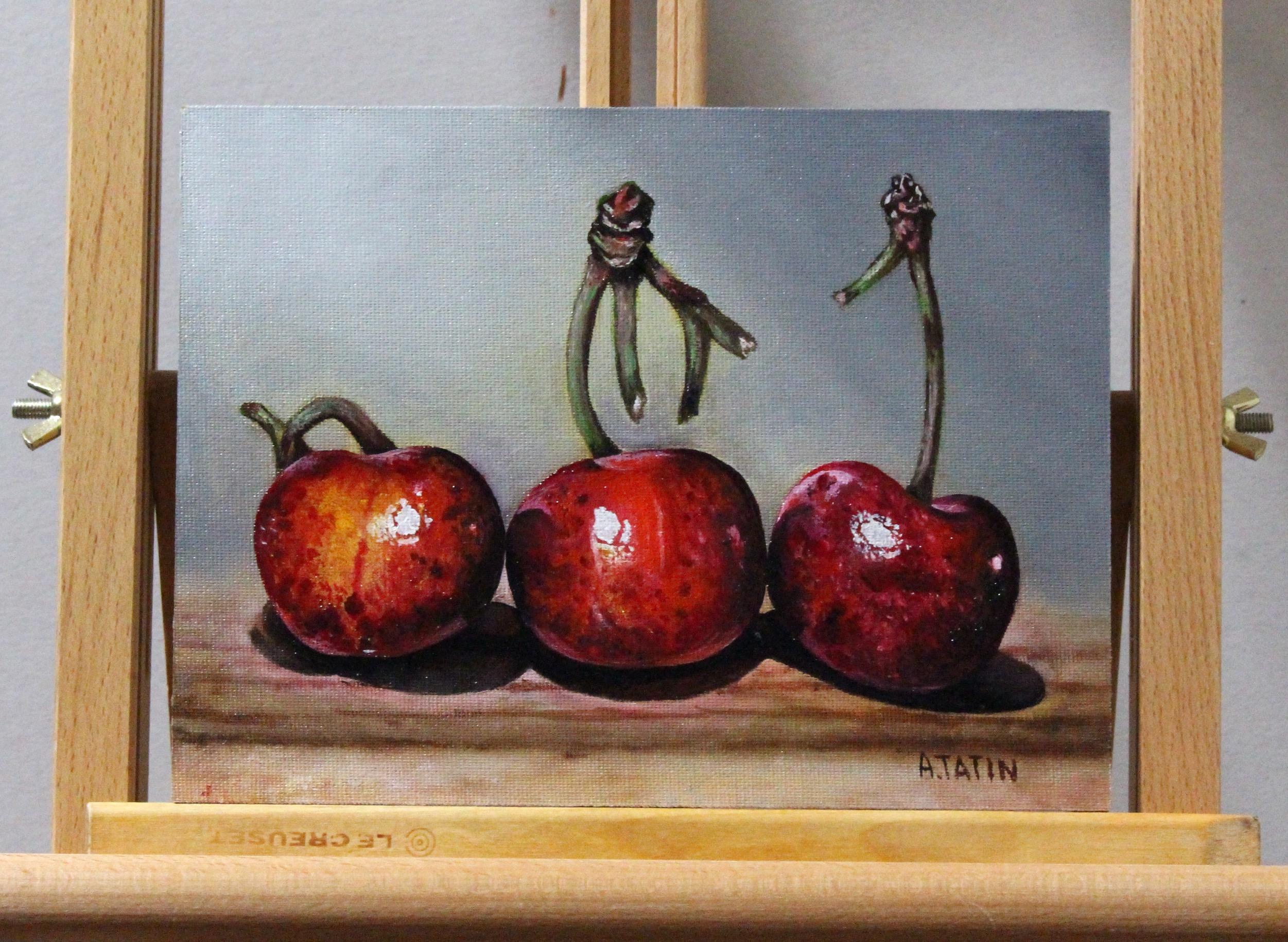 <p>Artist Comments<br>Three juicy cherries line up on a table, with the light enhancing their luminous and vibrant color. The sharp and detailed rendition of the fruit imparts a realistic quality to the composition. Painted with Flemish techniques,