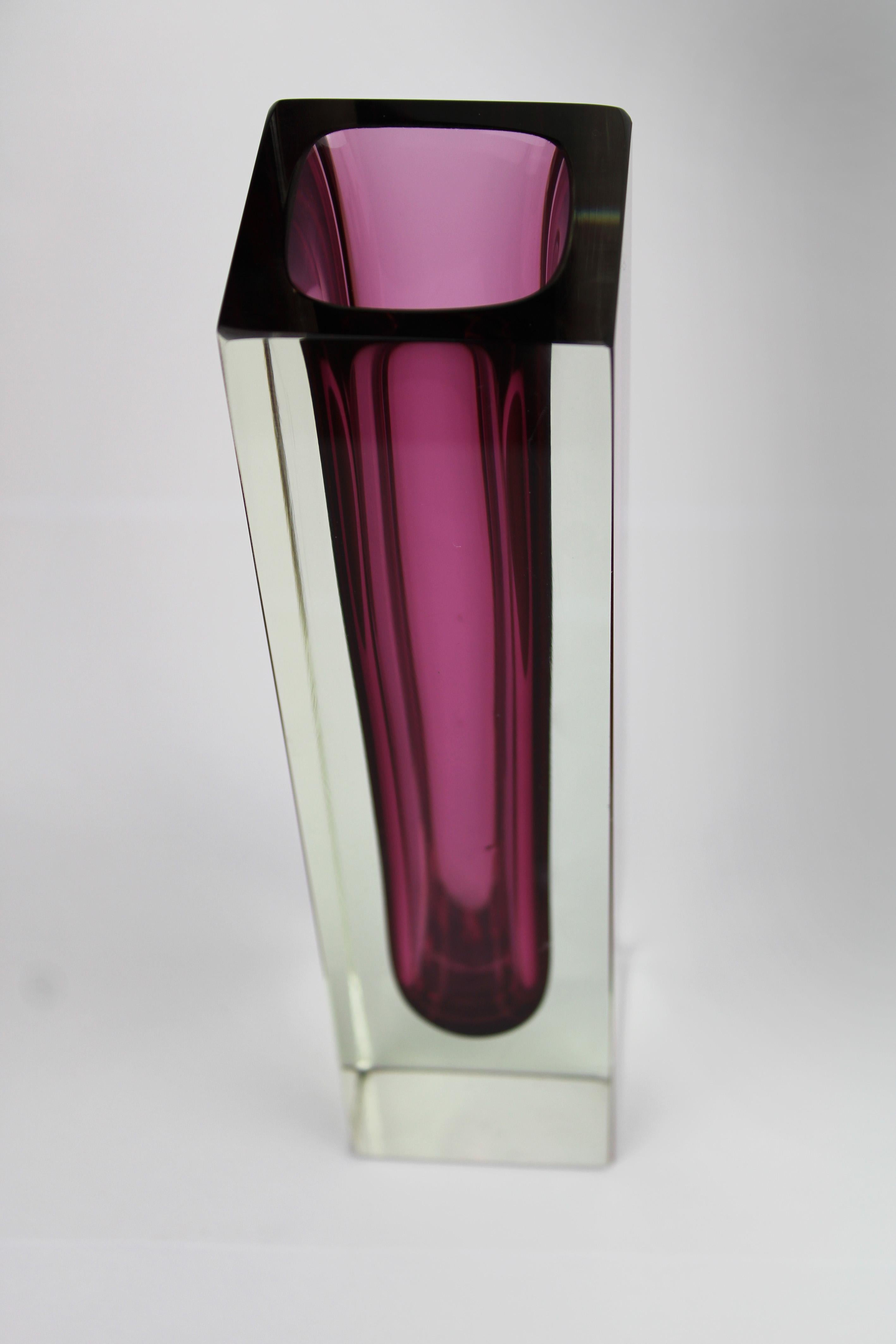 Enhance your collection with this sophisticated Art Vase from Murano, designed by the renowned Flavio Poli and produced by Mandruzzato in the 1960s. Featuring the elegant Sommerso technique, the vase combines rich aubergine and clear glass, creating