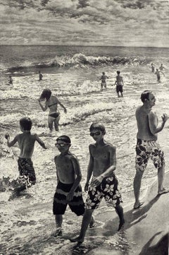 Tidal Shift # 1 (Young bathers stroll on beach with others out in surf Montauk)