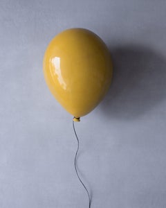 Honey yellow glossy ceramic balloon sculpture handmade for wall, ceiling