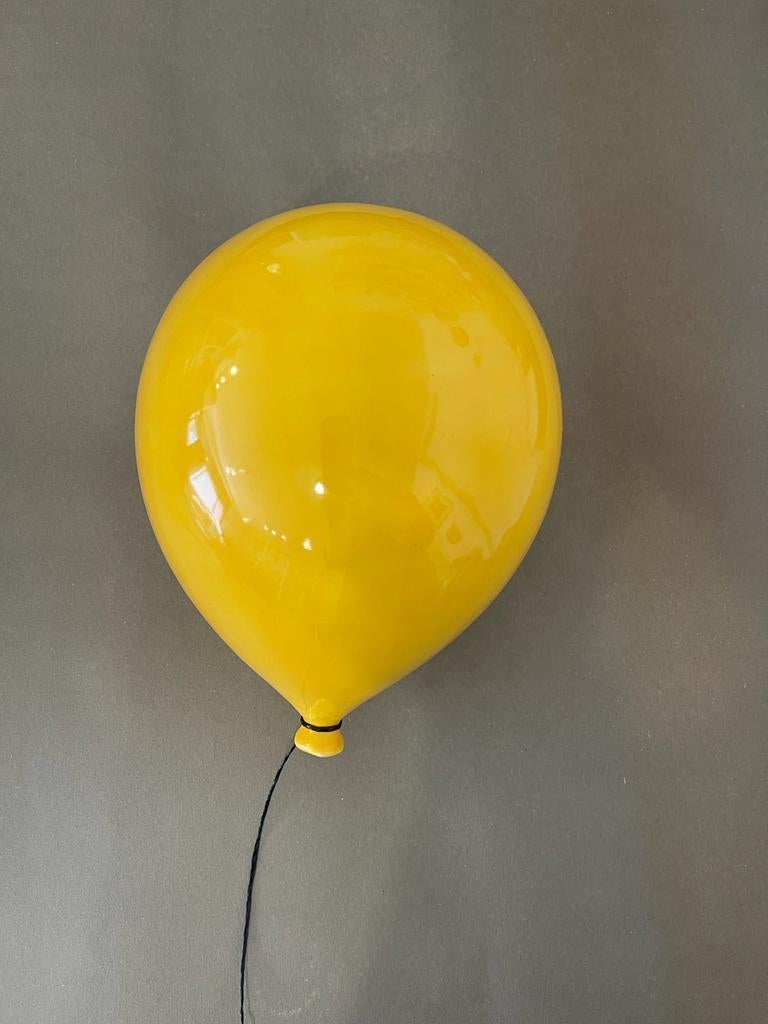 Yellow glossy ceramic balloon sculpture handmade for wall, ceiling installation