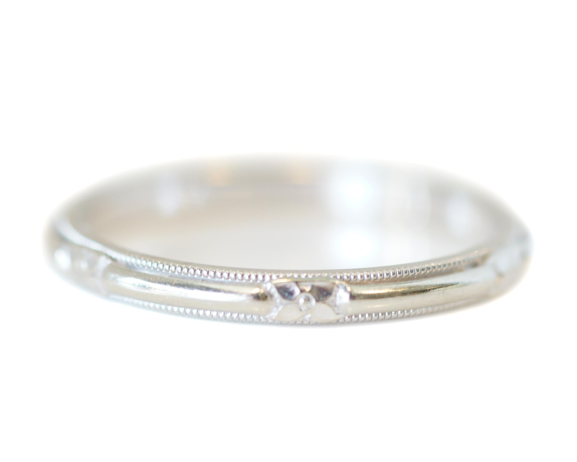 Here we have a classic, elegant, and simple style wedding band. Crafted in 14k white gold, with a visible hallmark inside the shank... this beauty is all antique-charm! Belonging to circa 1930s, on the tail end of art-deco era... it features lovely