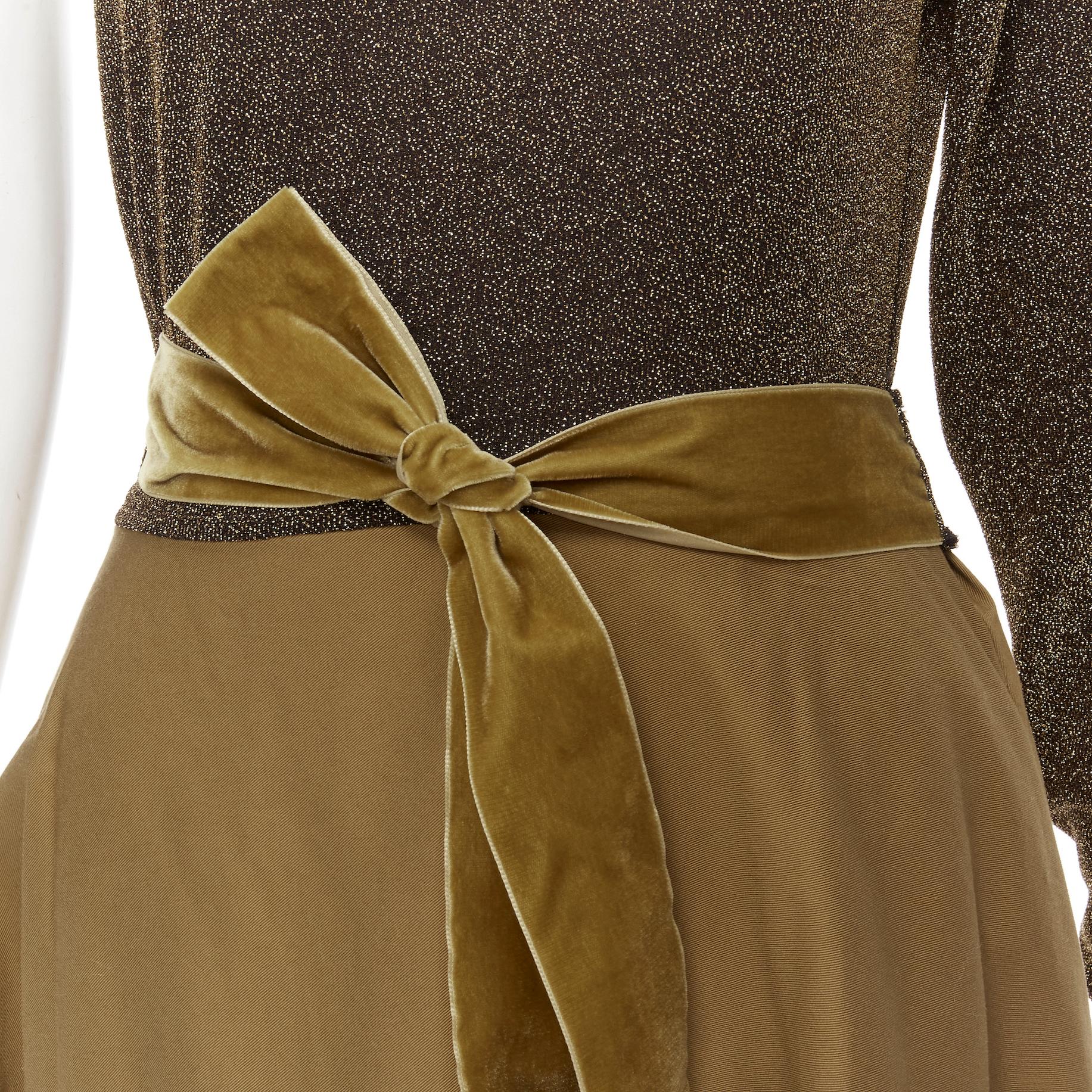 ARTCLUB Casa Miller gold lurex brown cotton twill wrap maxi dress M 
Reference: KEDG/A00070 
Brand: Artclub 
Designer: Heidi Middleton 
Material: Fabric1: 100% cotton; fabric2: 57% nylon, 35% Lurex, 8% spandex; trim: 100% polyester 
Color: Brown