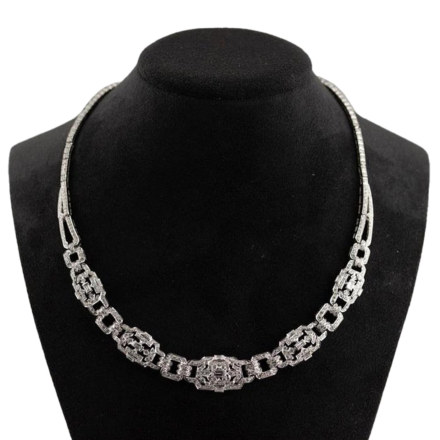 A Fabulous ArtDeco Necklace that makes a statement on its own, This 12.85ctw diamond necklace features Round and Emerald cut diamonds to create a stunning, shimmering effect. The diamonds are set in Platinum. Diamond color is F color, Diamond