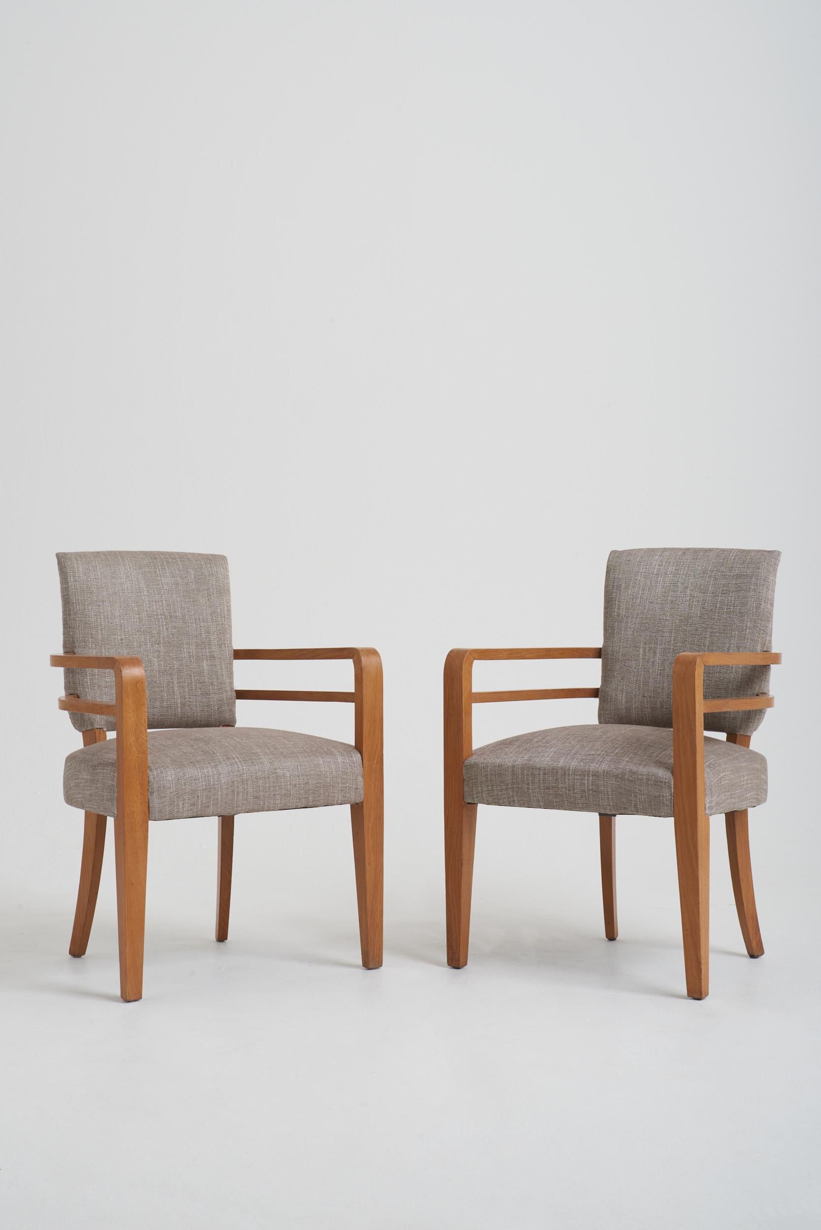 A pair of oak armchairs by Maurice Jallot (1900-1971).
France, Circa 1940.