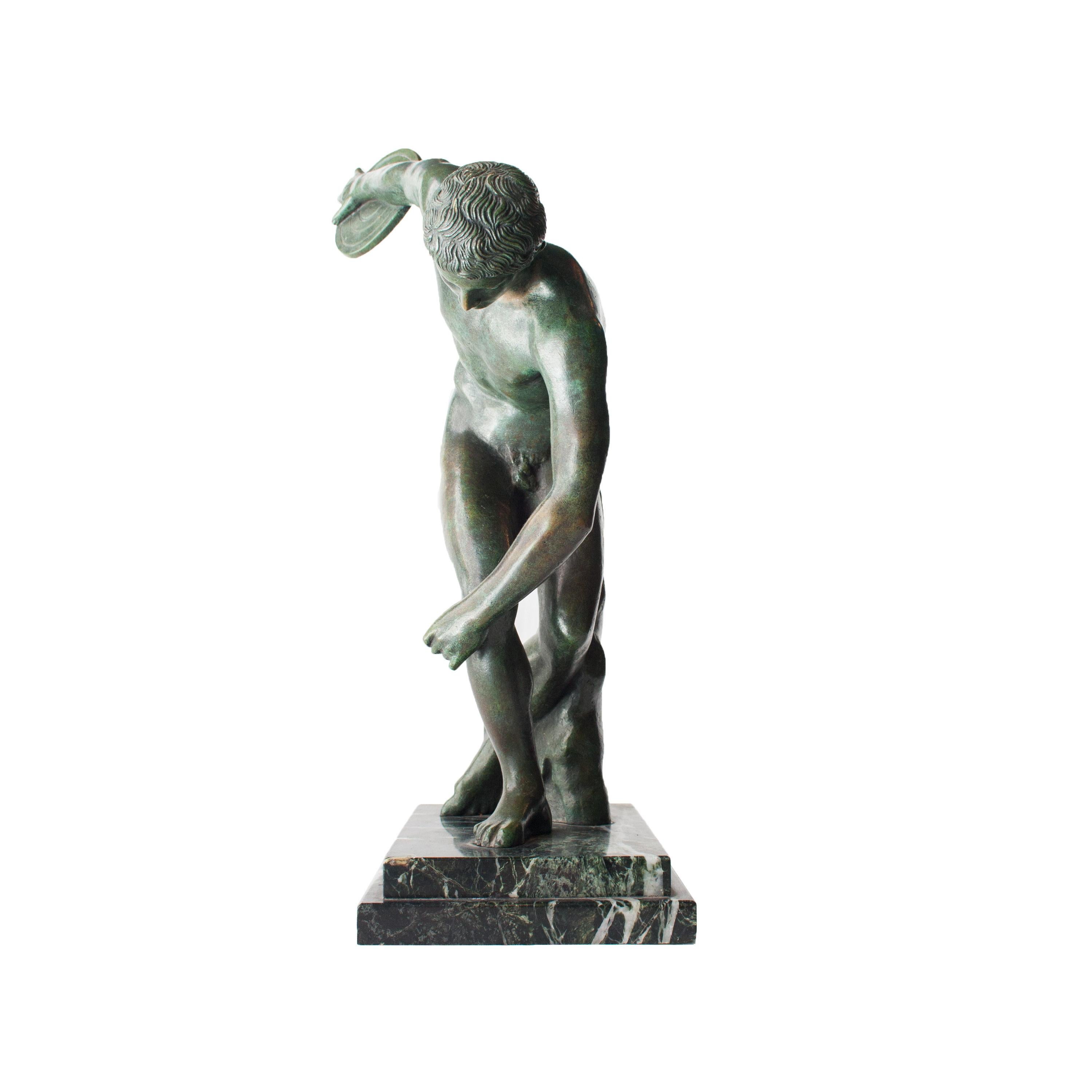 Art Deco “Discobolo” bronze sculpture with green patina and Indian marble base made in France in 1920.