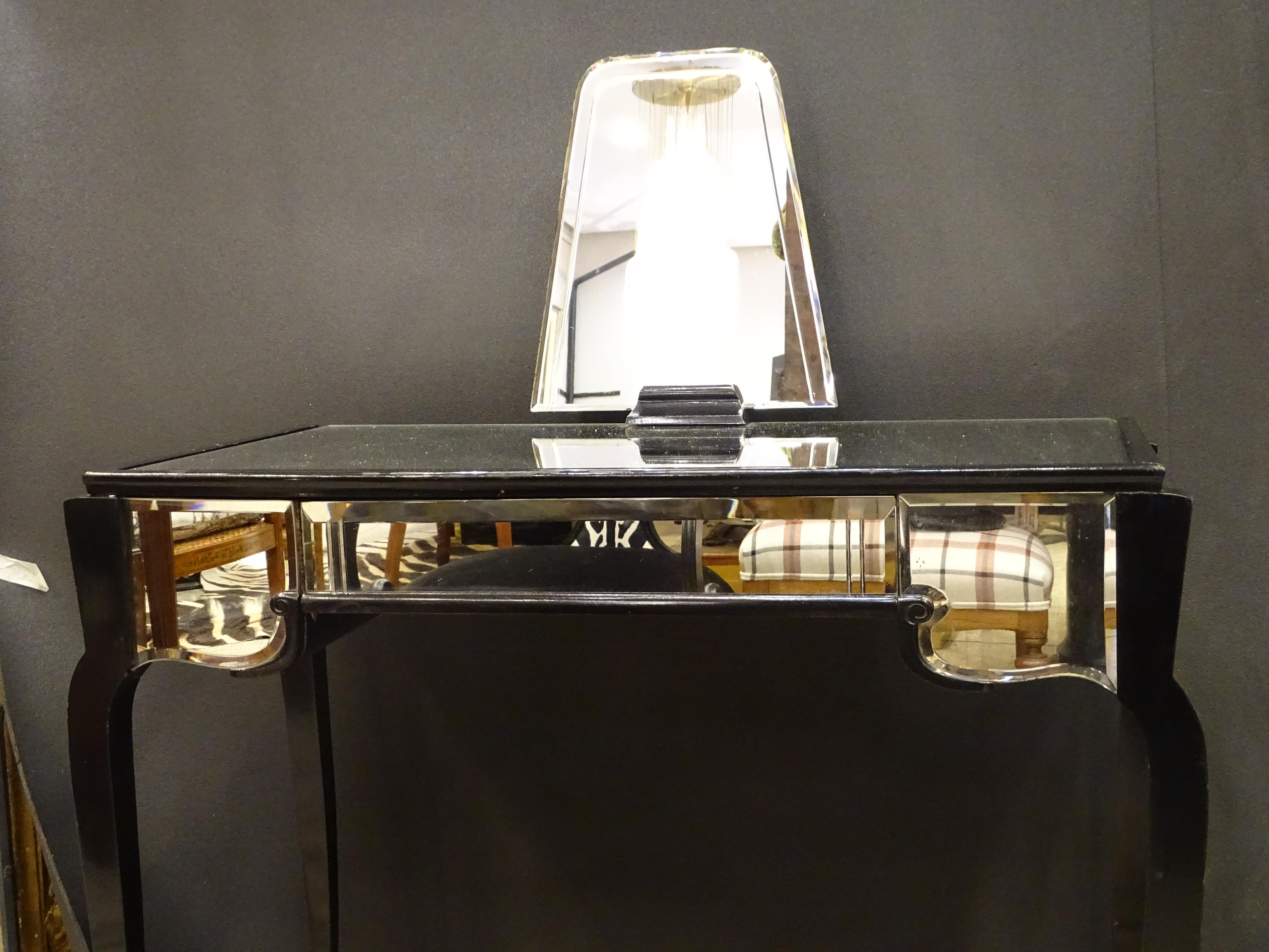 Outsanding Art Deco dressing table or vanity table, 30s, France.
 Original Déco design, France , private collection 
It was made in the 1930s in the context of art deco aesthetics. The piece of furniture is made up of a console-type structure with