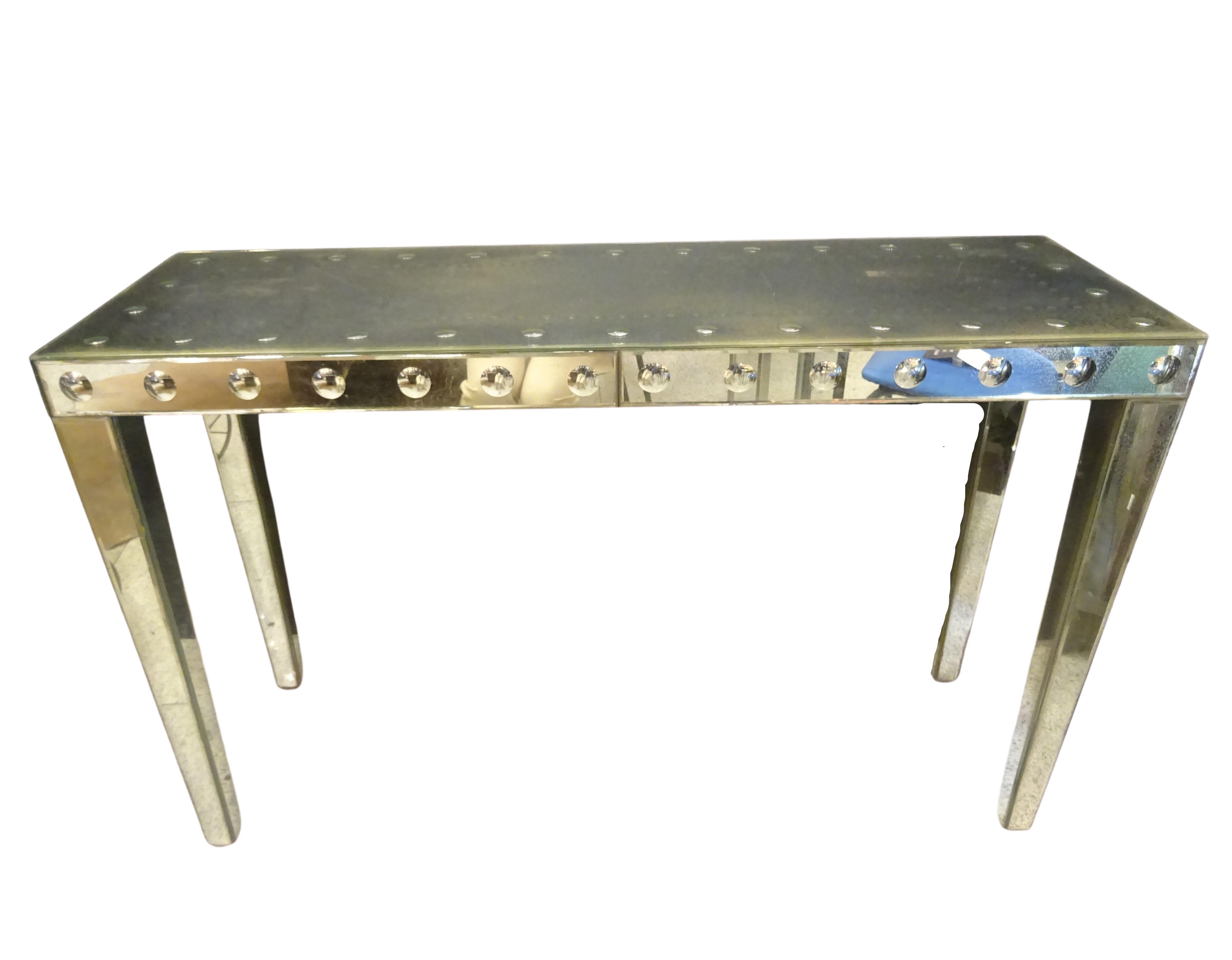 Stunning French console, Art Deco, circa 1940, it is made of mercury or flustered mirrors with bubbles of convex mirrors in the front and on the surface, 4 faceted legs covered with mirrors.
It’s an amazing piece, very sought after!!!
It was
