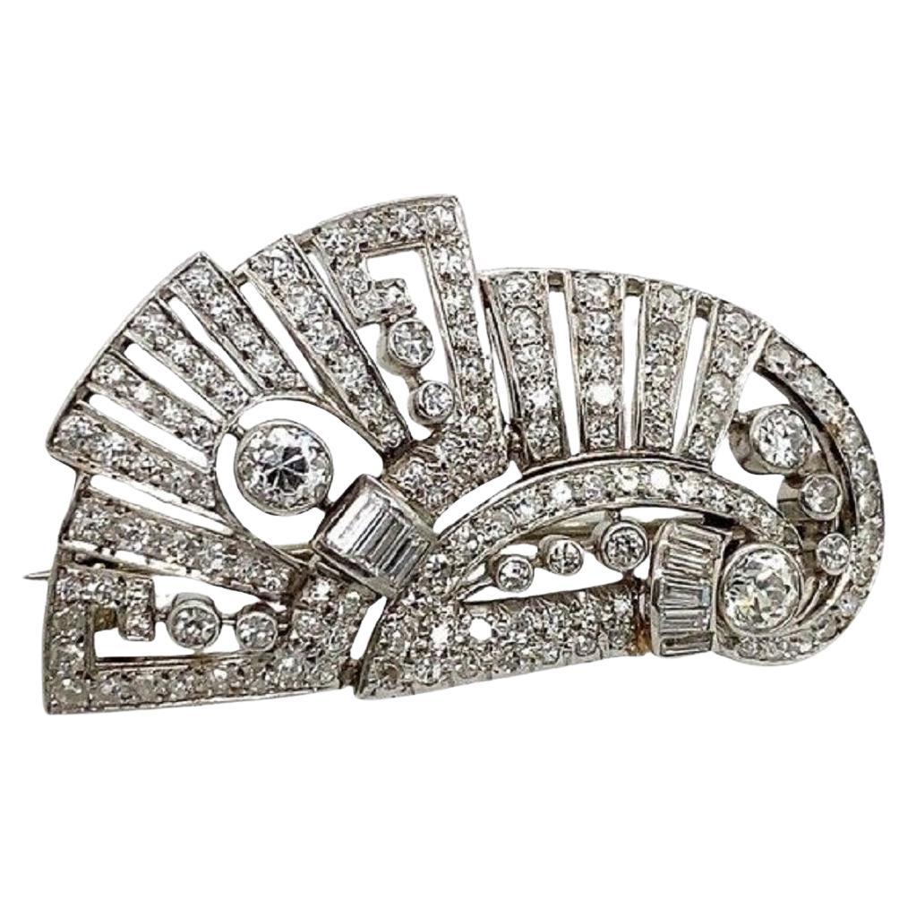 This stunning vintage brooch features 1.80ct of Round and Baguette Diamonds, set in Platinum. This is a perfect gift for any occasion.  

Additional Information:
Total Gold Weight: 12.3g
Total Diamond Weight: 1.80ct
Diamond Colour: G/H
Diamond