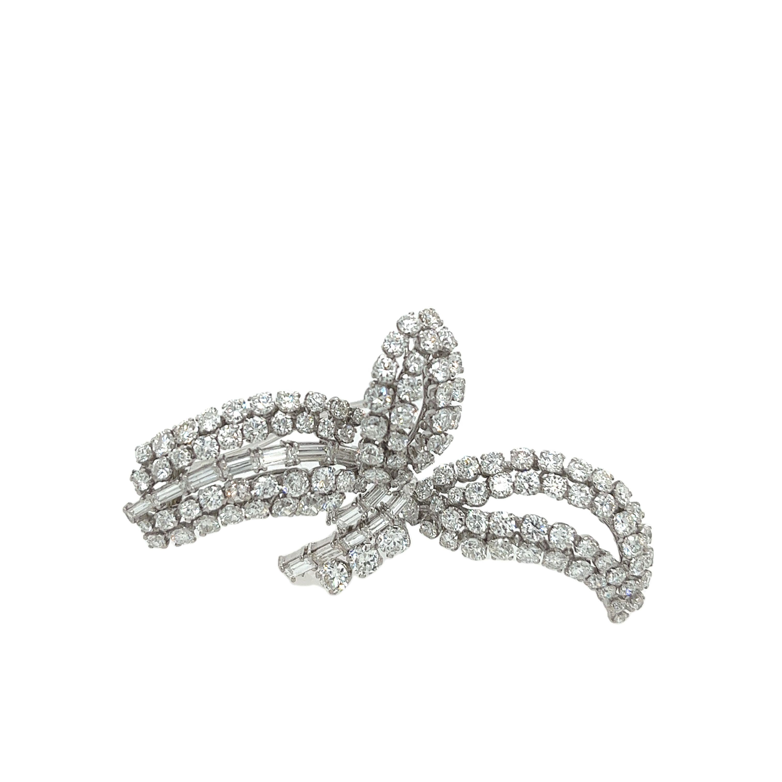 This stunning vintage brooch features 6.40ct of 
round brilliant cut and baguette diamonds, 
set in platinum & white gold setting. This stunning brooch is crafted with meticulous attention to detail, combining the brilliance of diamonds with the