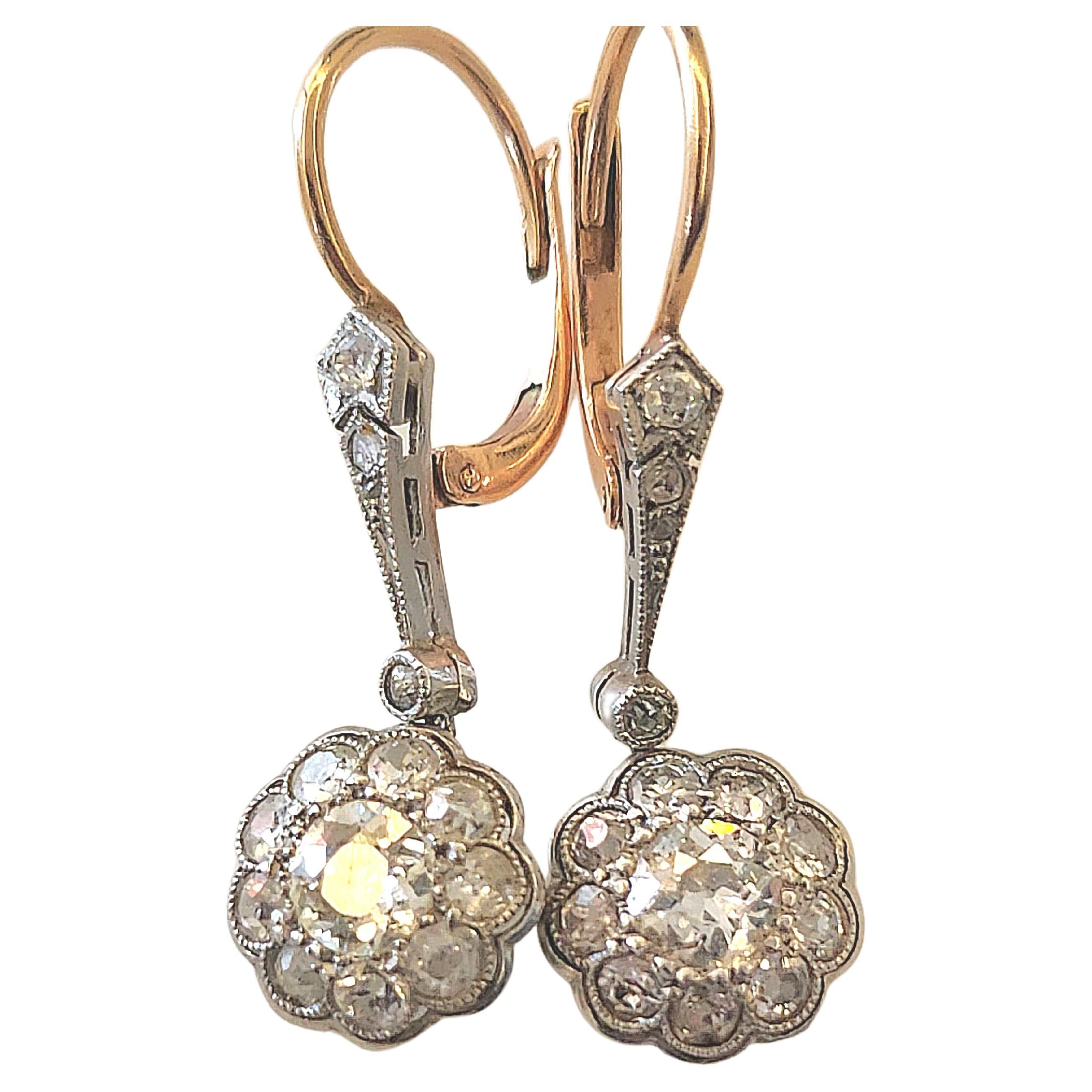 Antique art deco era dangling earrings centered with old mine cut diamond with total estimate 1 carat for both stones in platinum setting and gold back locks earrings head diameter 8.25mm and 3cm lenght delicate piece of antique jewelry dates back