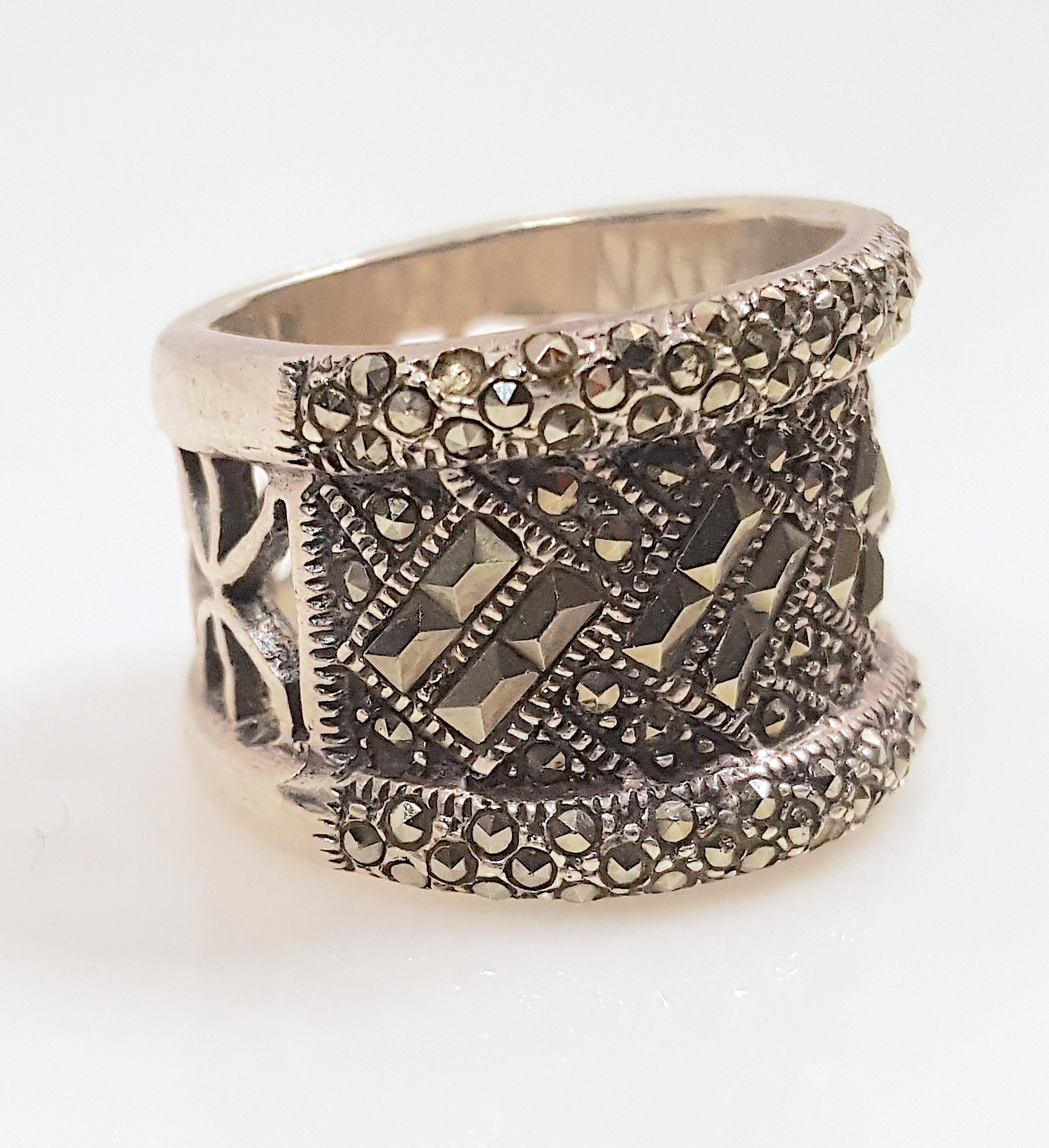 Encrusted with mixed-cut pyrite and marcasite stones for gold and silver reflections, this extremely-sparkly double-rimmed wide thick sterling-silver ring was designed by an artisan in an Art Deco style with openwork that is a modern take on
