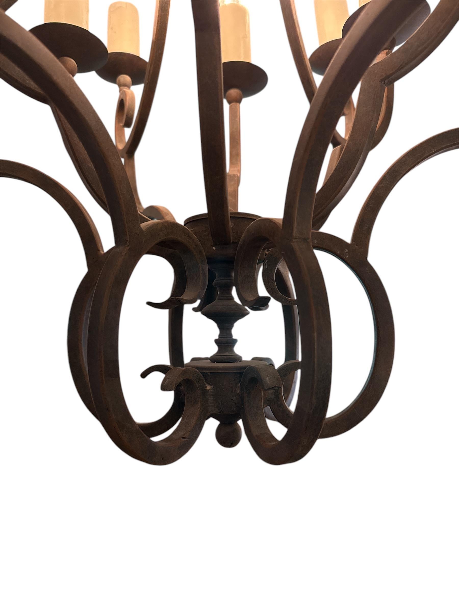 Bring timeless elegance and rich artisan craftsmanship into your home with the Arte De Mexico Wrought Iron 12-Light Chandelier. This stunning, hand-forged chandelier is a true statement piece, blending traditional Mexican craftsmanship with the