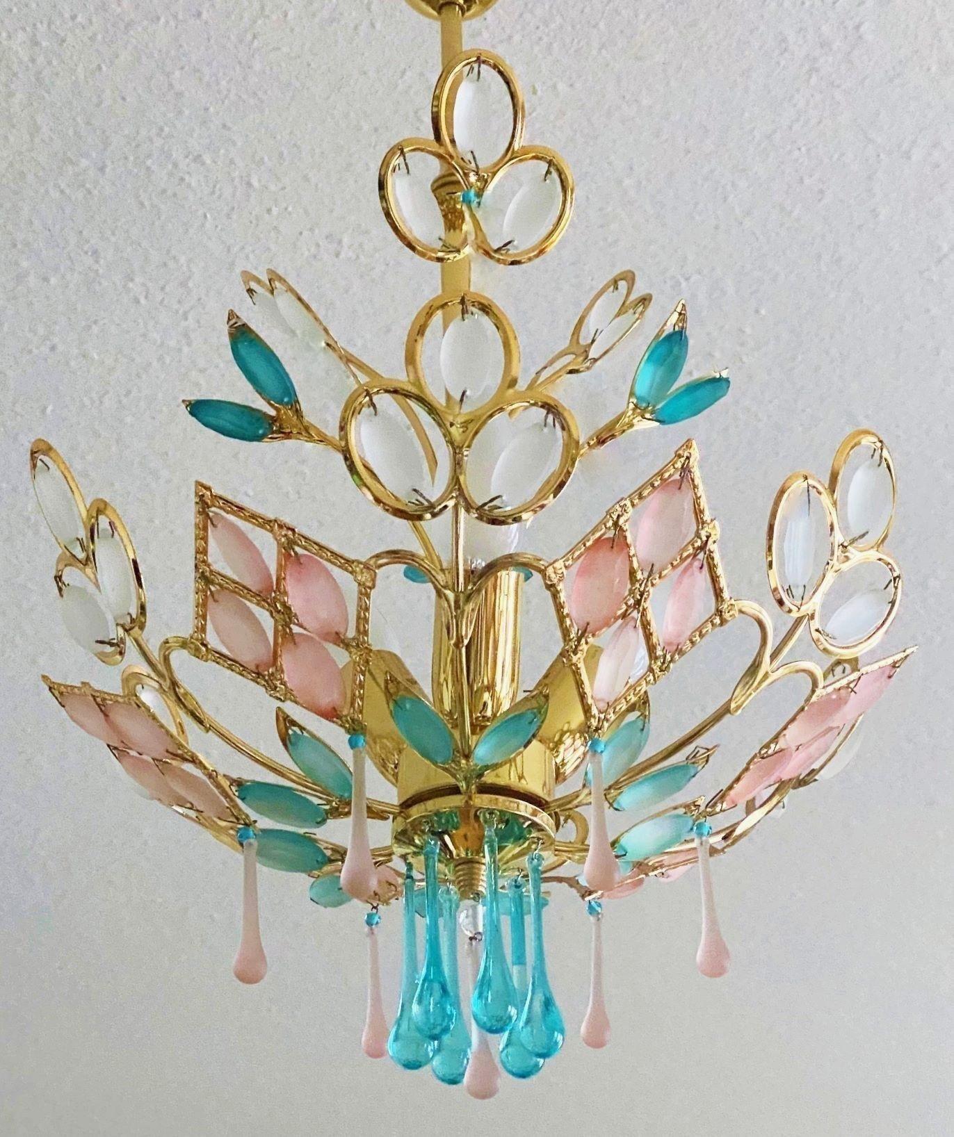 A magnificent romantic ceiling light in Art Deco style of the mid-century, Italy, 1960s. Structure of solid gilded brass topped with lots of Murano frosted glass beads in turquoise blue, pink and white colours.
Beautiful and very decorative piece