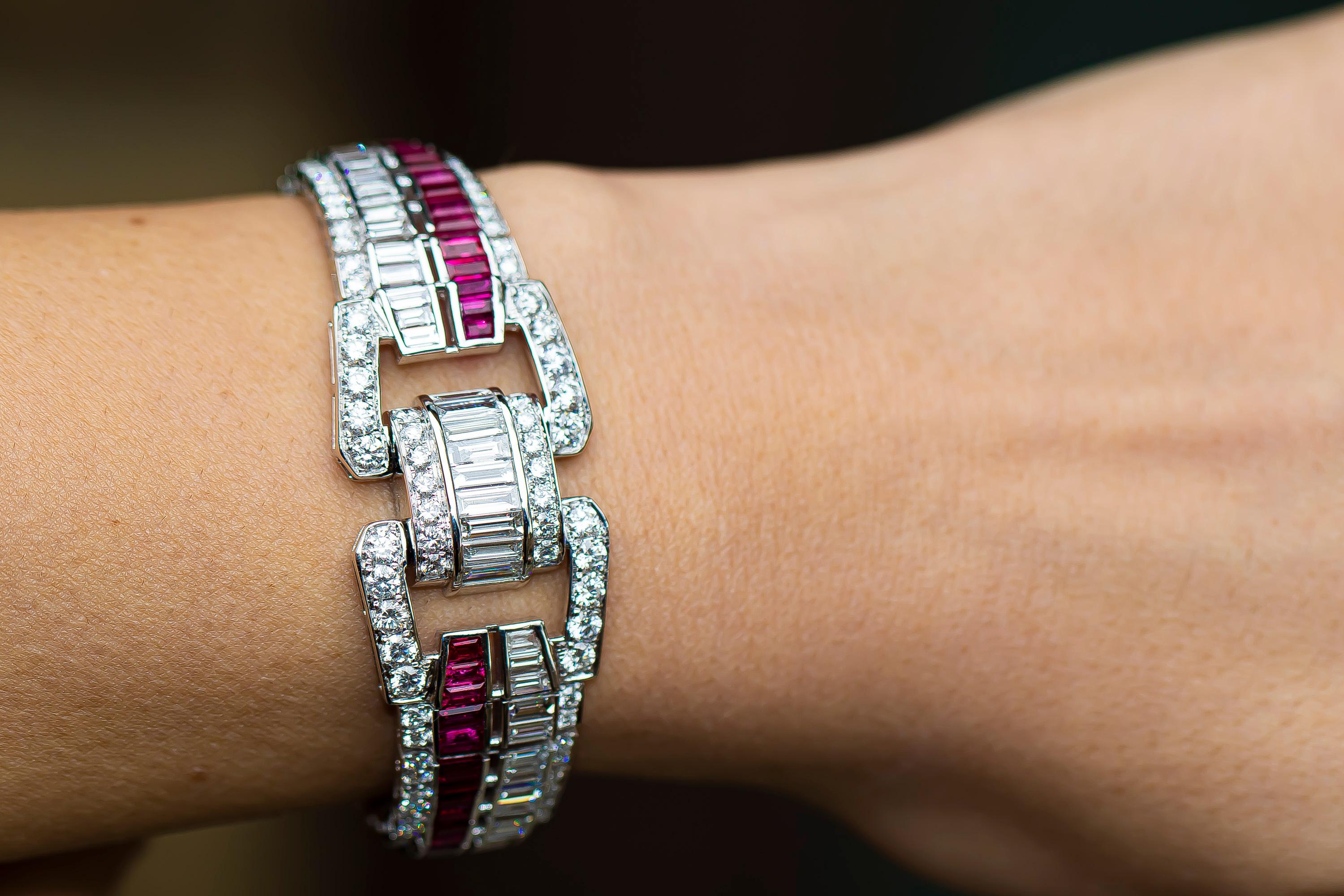 The craftsmanship of this bracelet is exceptional. The rubies and diamonds are top quality. 
The construction of the links is some of the finest work I have seen in my 30 years in the trade.  

Diamonds = 9.90 Carats
( Color: E-F, Clarity: VS )
Fine