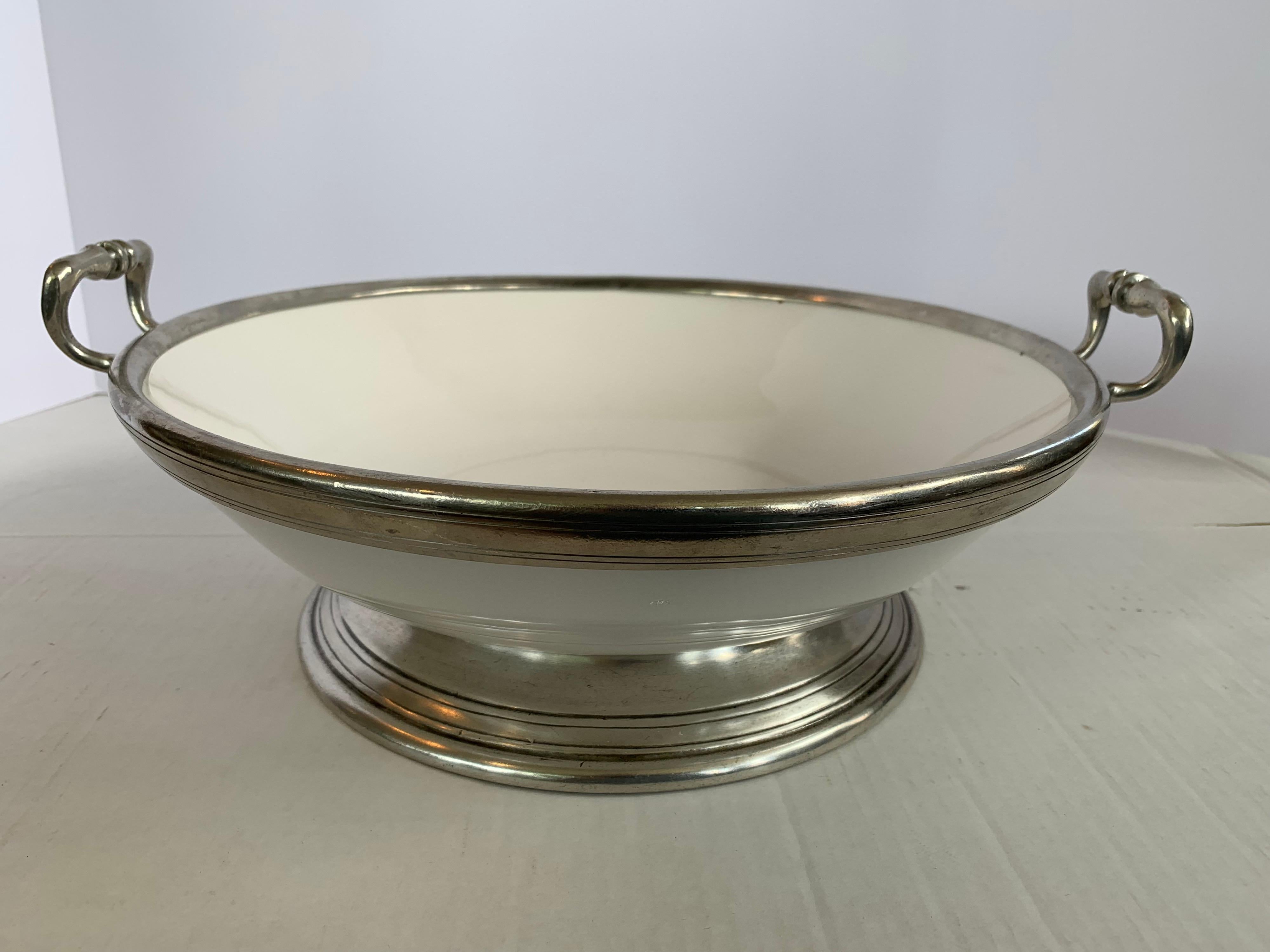 Large Arte Italica serving bowl with silver rim, base and handles. There is a matching handed platter that is in another listing on our 1stdibs platform this week.