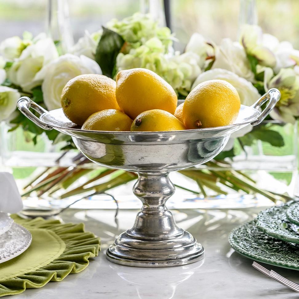 A new all'antica style pedestal bowl with handles. Made to appear like a true Grand Tour creation, dated 1795, each vintage-style piece produced by Arte Italica is a marriage of the highest quality pewter combined with the talents of Italian