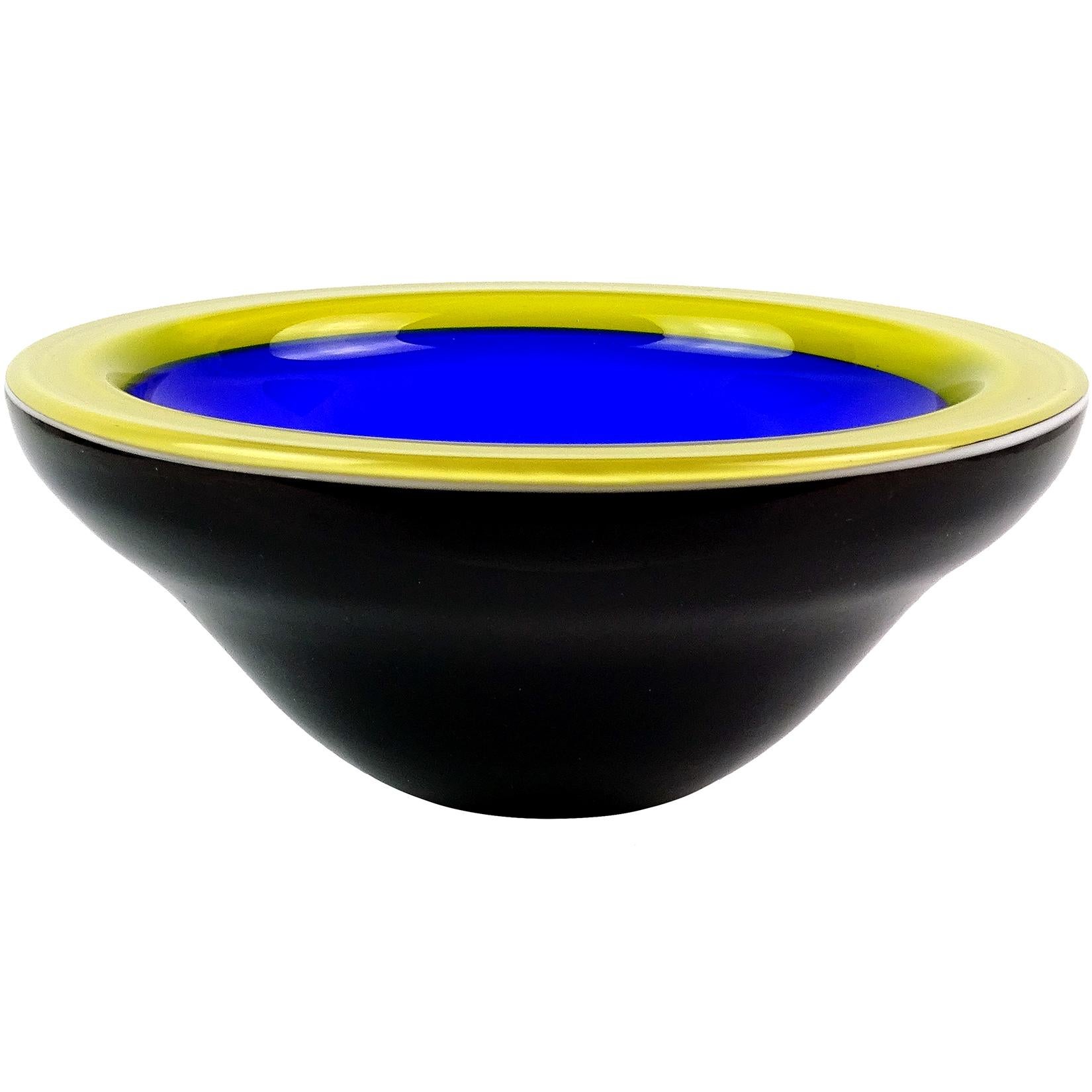Beautiful vintage ICET Arte Murano hand blown rich cobalt blue, yellow and black art glass bowl. Signed underneath. Made in Venezuela, but crated in the manner of the Italian Murano workshops. The bowl is very deep, with a gorgeous contrasting color