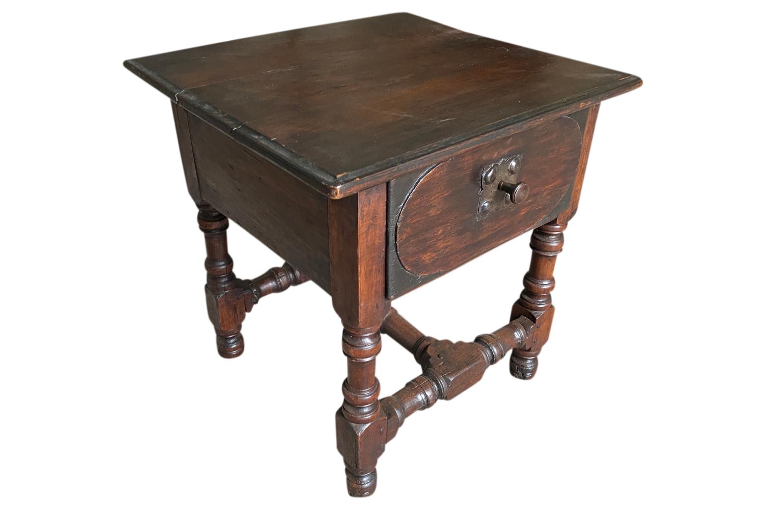 A very charming 18th century Arte Populaire side tale from the Ardeche region of France. Soundly constructed from beautiful walnut and oak with a single drawer and nicely turned legs.