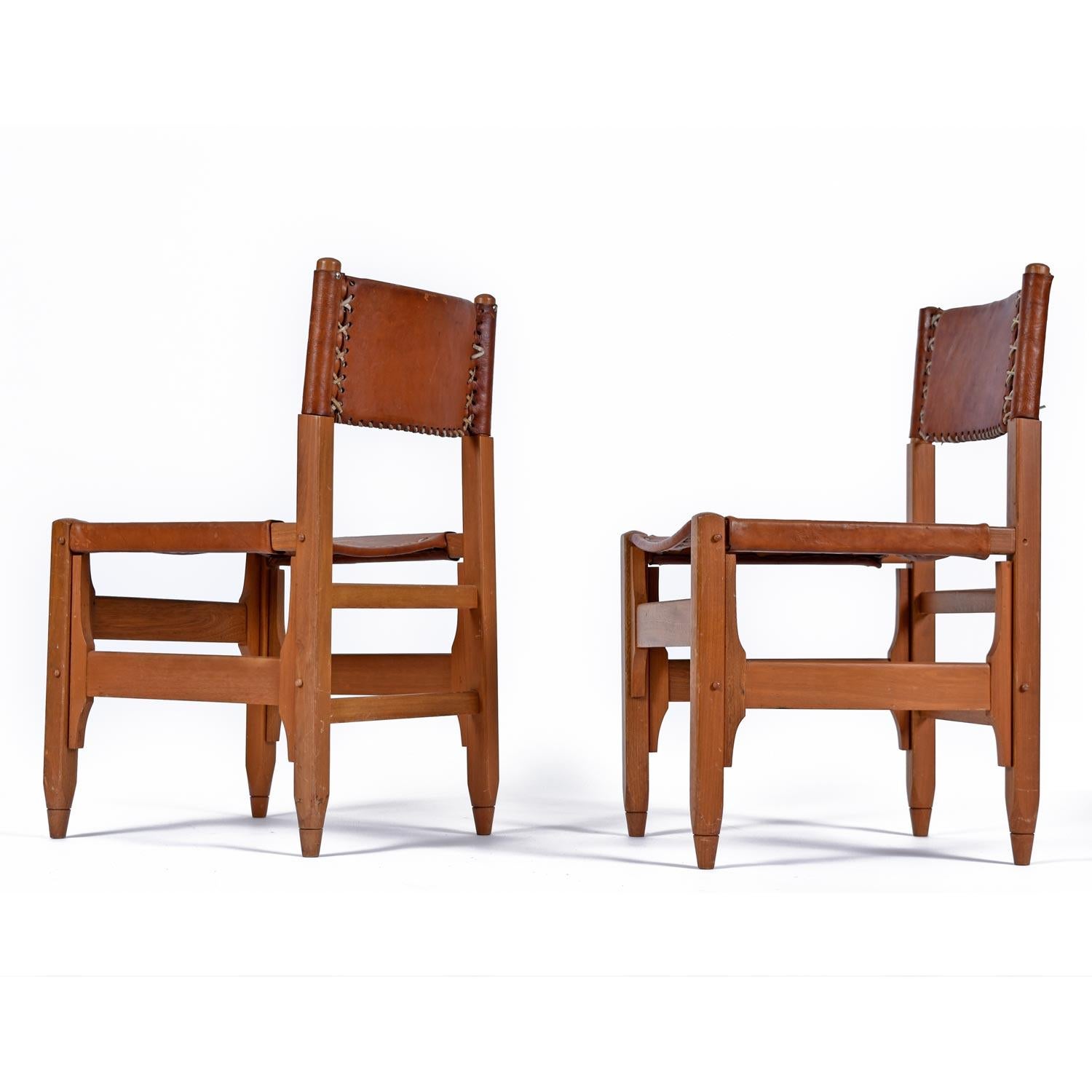 Outstanding group of four rare hunting lodge chairs designed by Biermann Werner for Arte Sano. The chairs are made of hand-tanned cognac colored leather. The stout wood frames are crafted from solid white walnut wood. White leather chording binds