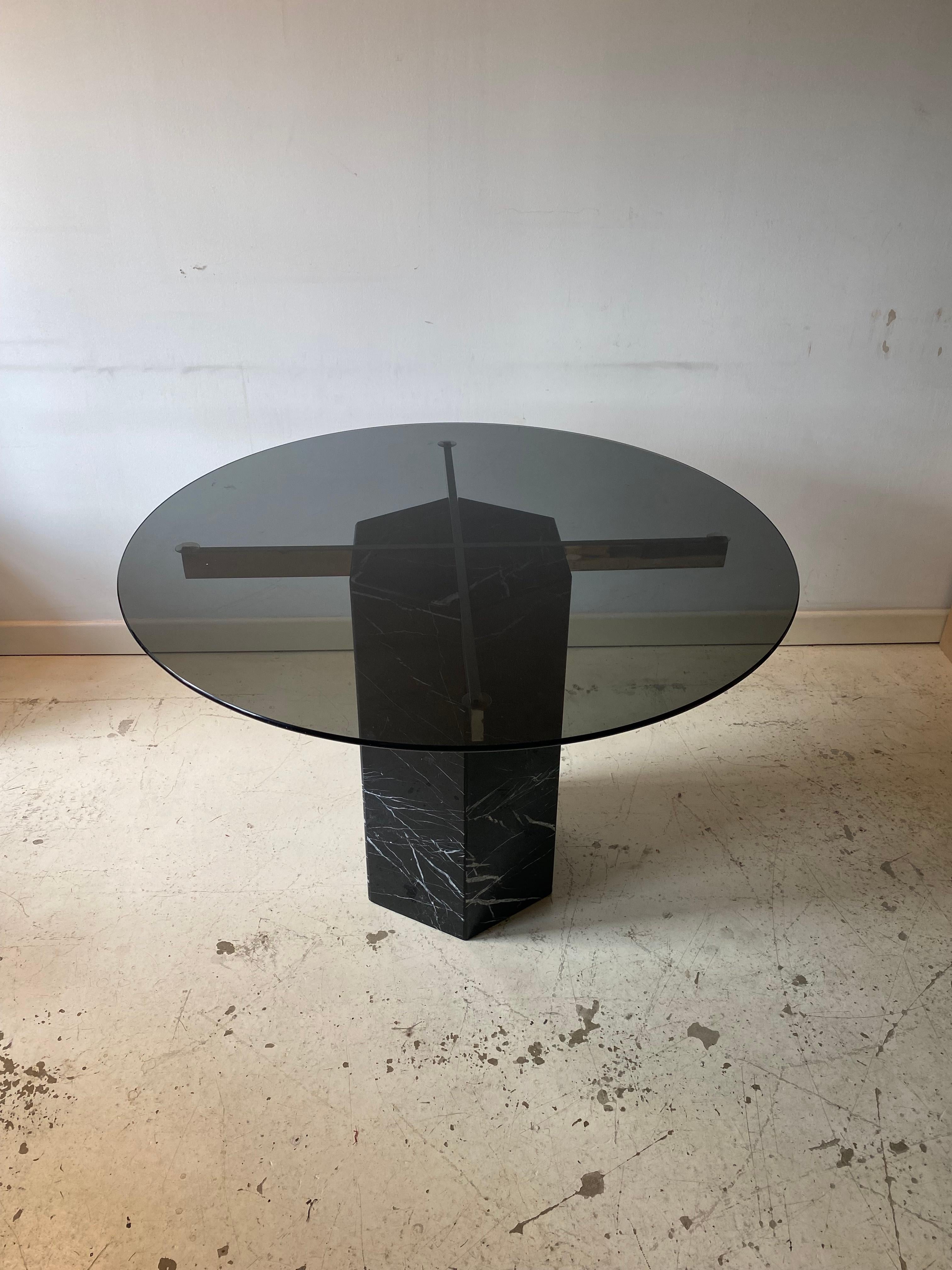 Beautiful black Carrara marble hexagon plinth dining table with chrome frame where the round smoked glass sits. 
Easy to use either in the breakfast room or any small dining area, or even for outdoors. 

Please contact us for international postage