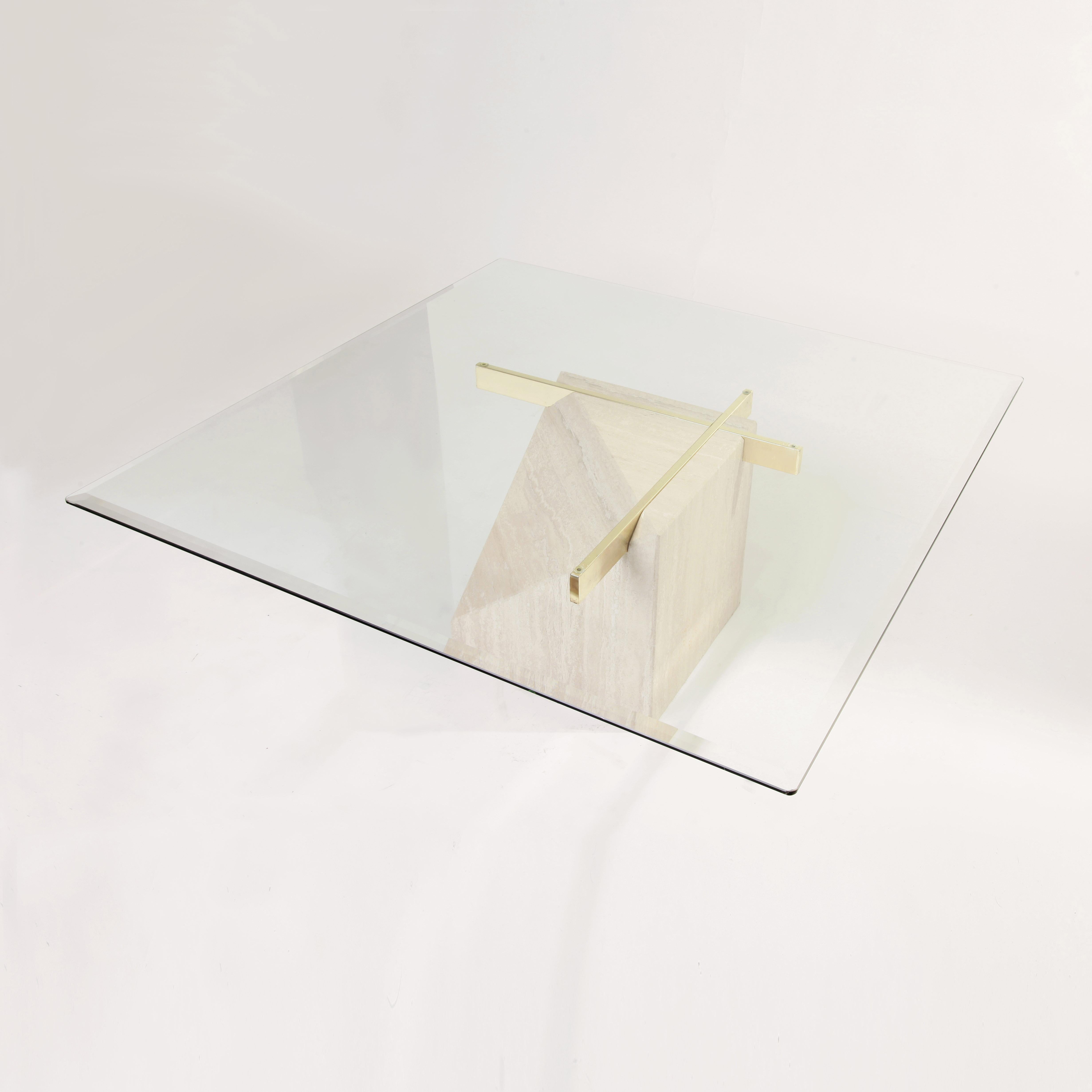 1970s coffee table designed and manufactured by Artedi, Italy. Travertine base with brass plated metal support. Clear square glass top. Wear consistent with age and use. Possible small chip on the travertine. Please note, the actual table on the