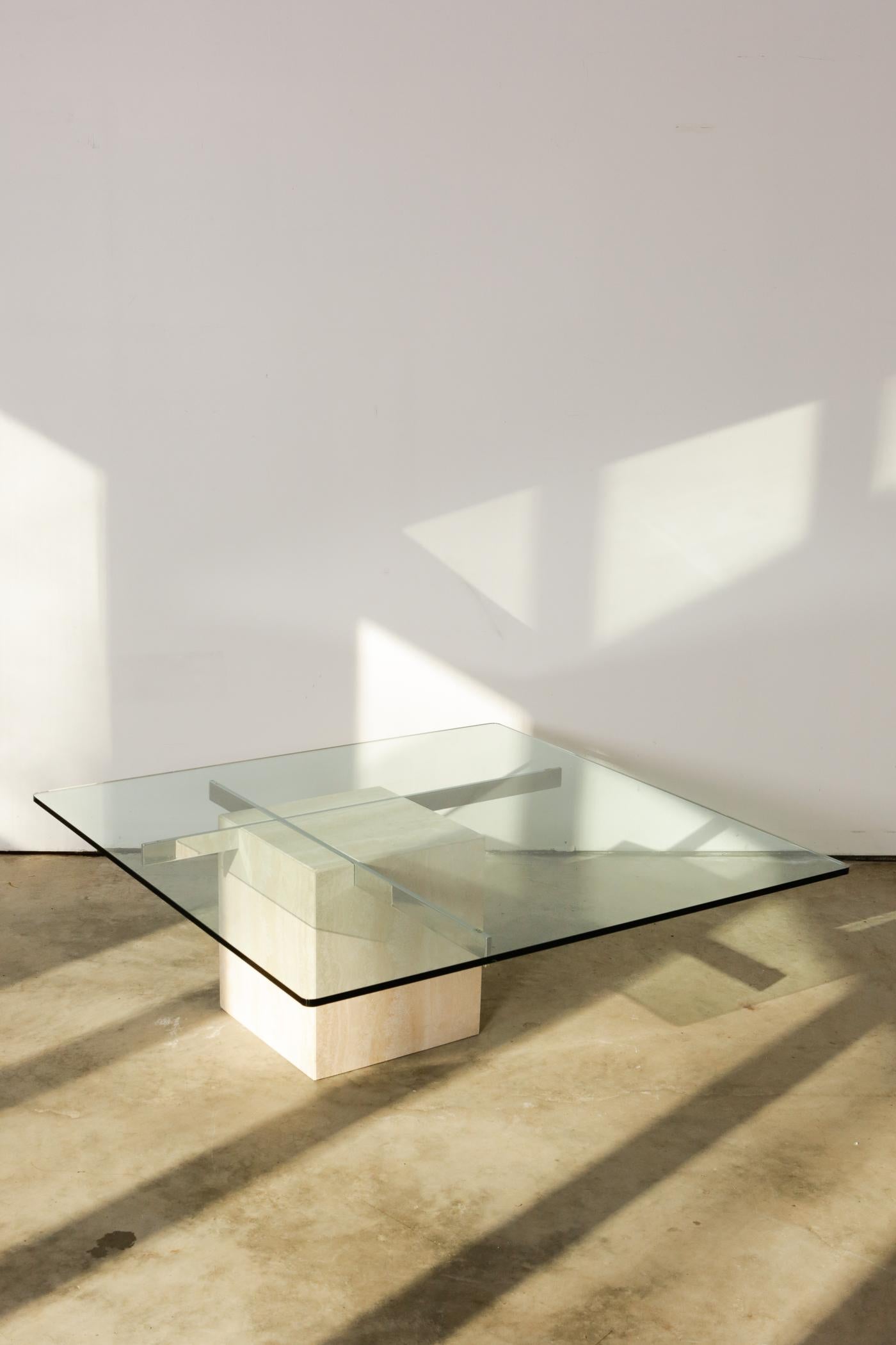 Italian Artedi travertine and chrome coffee table. This is a rare guy. Artedi usually uses brass for their travertine-and-glass combinations, but here we’ve got chrome. And we love it. The silvery shine elevates the warmer travertine stone just a