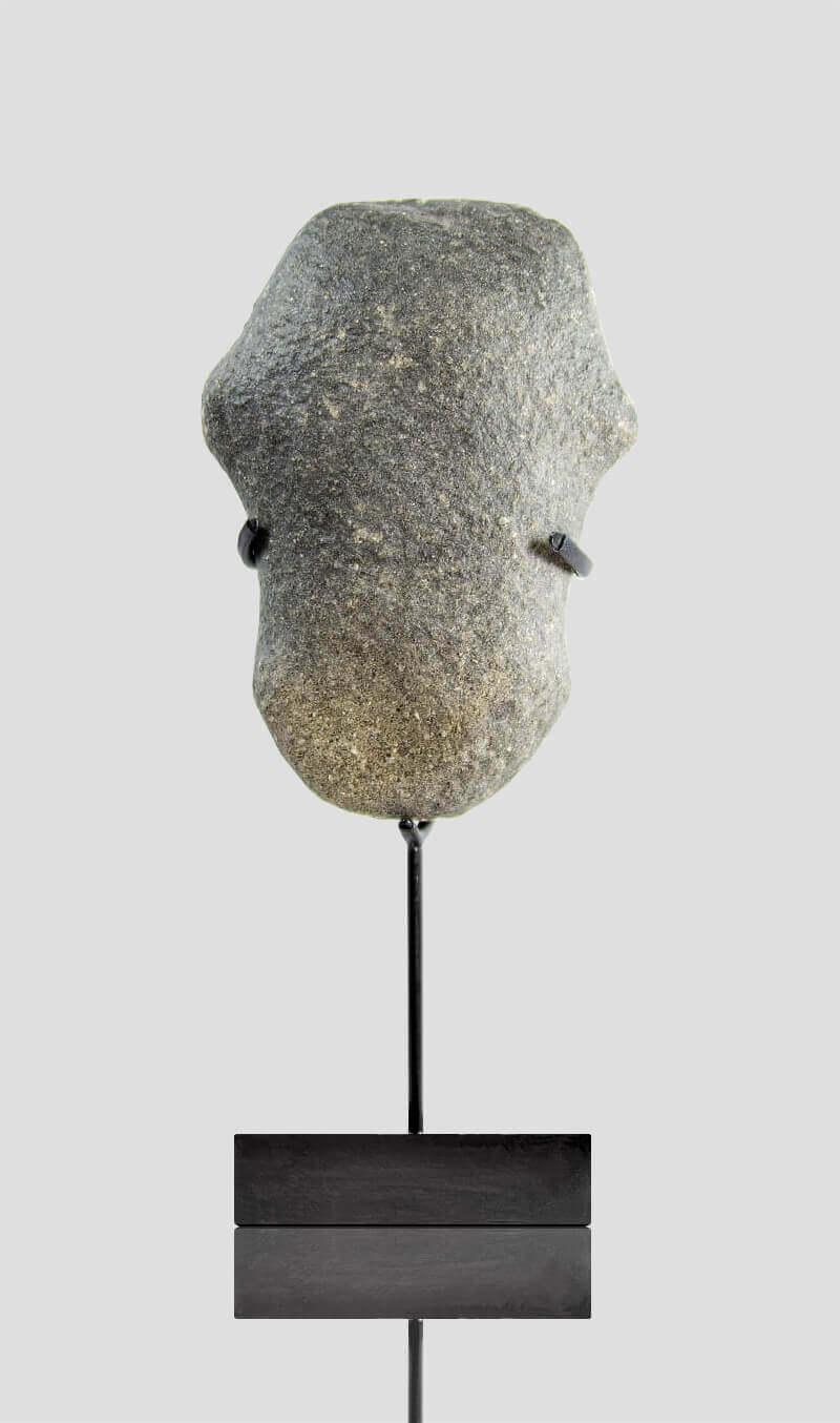 An Extraordinary and beautiful Neolithic stone artefact in the stylised form displaying a fine-honed surface. Now desert polished or what is often referred to as desert varnish, the patina created by time, which no other can imitate-the stable of