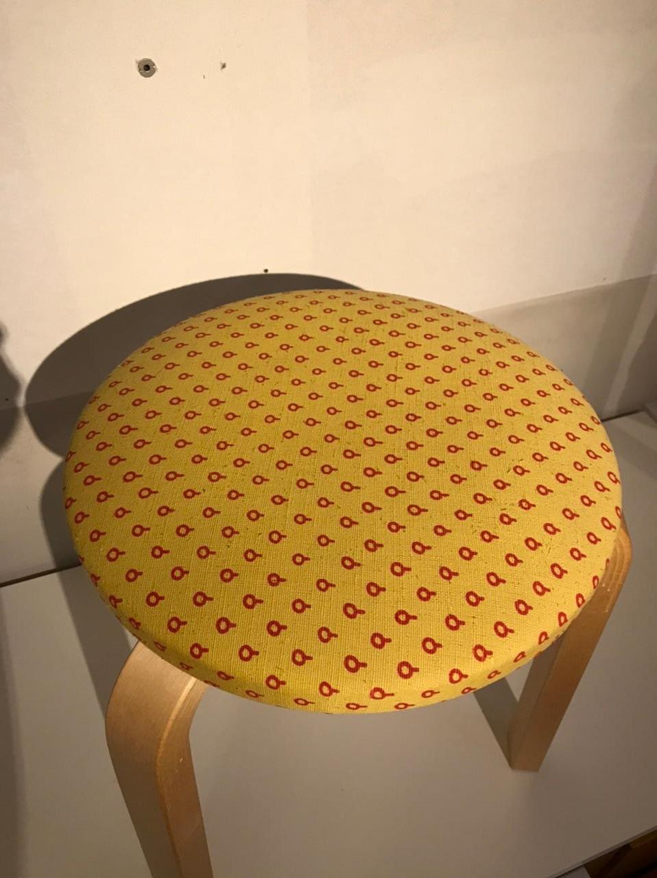 This stool is 4 years old.
The seat has been upholstered with old stock fabric designed by Alexander Girard.