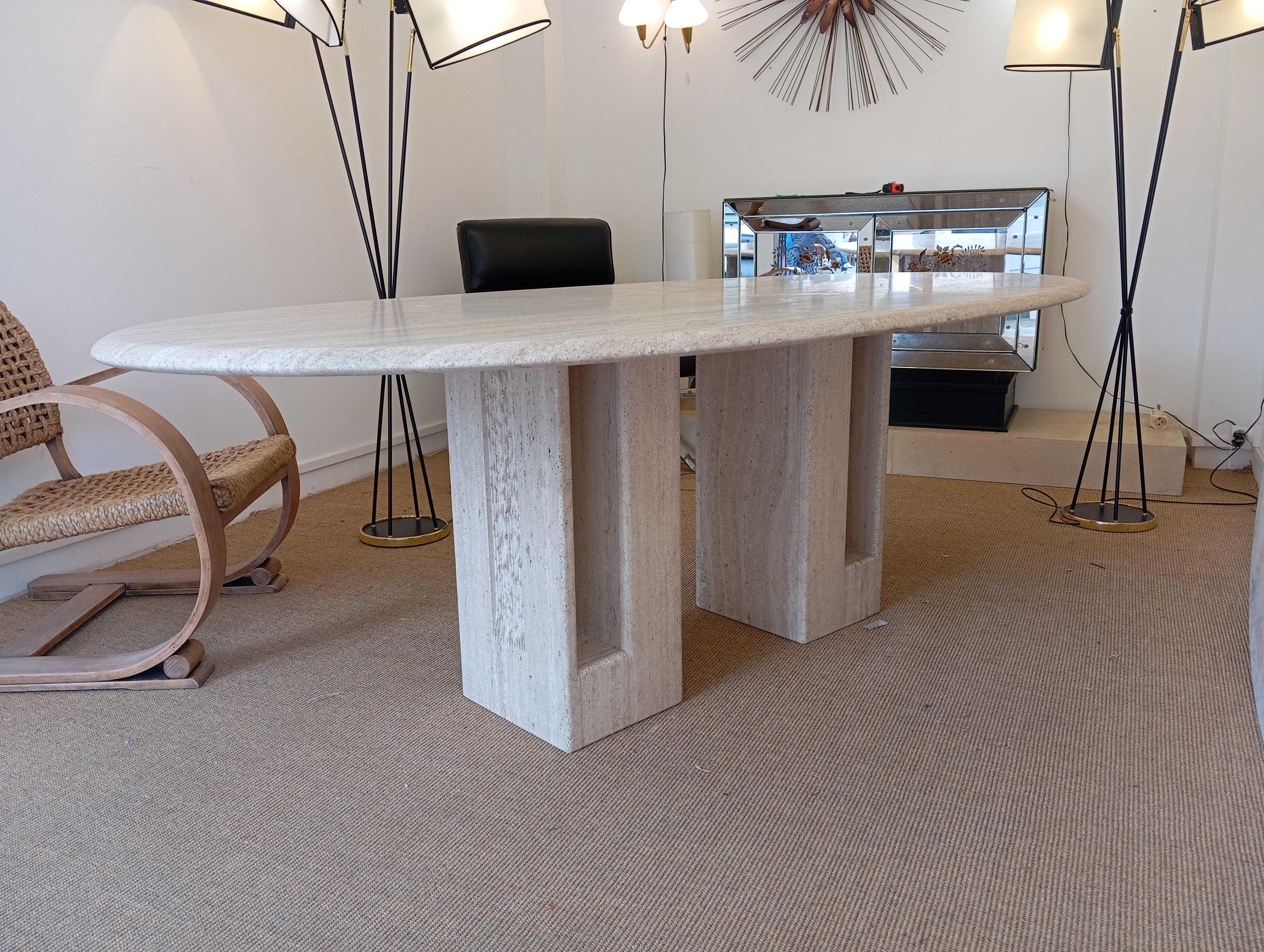 Table in natural travertine, consisting of an oval natural travertine top (220 cm long and 110 cm wide) resting on 2 rectangular travertine legs.
Leg spacing can be adjusted as required.
Italian work circa 1980 by Artélano.
Perfect condition. 