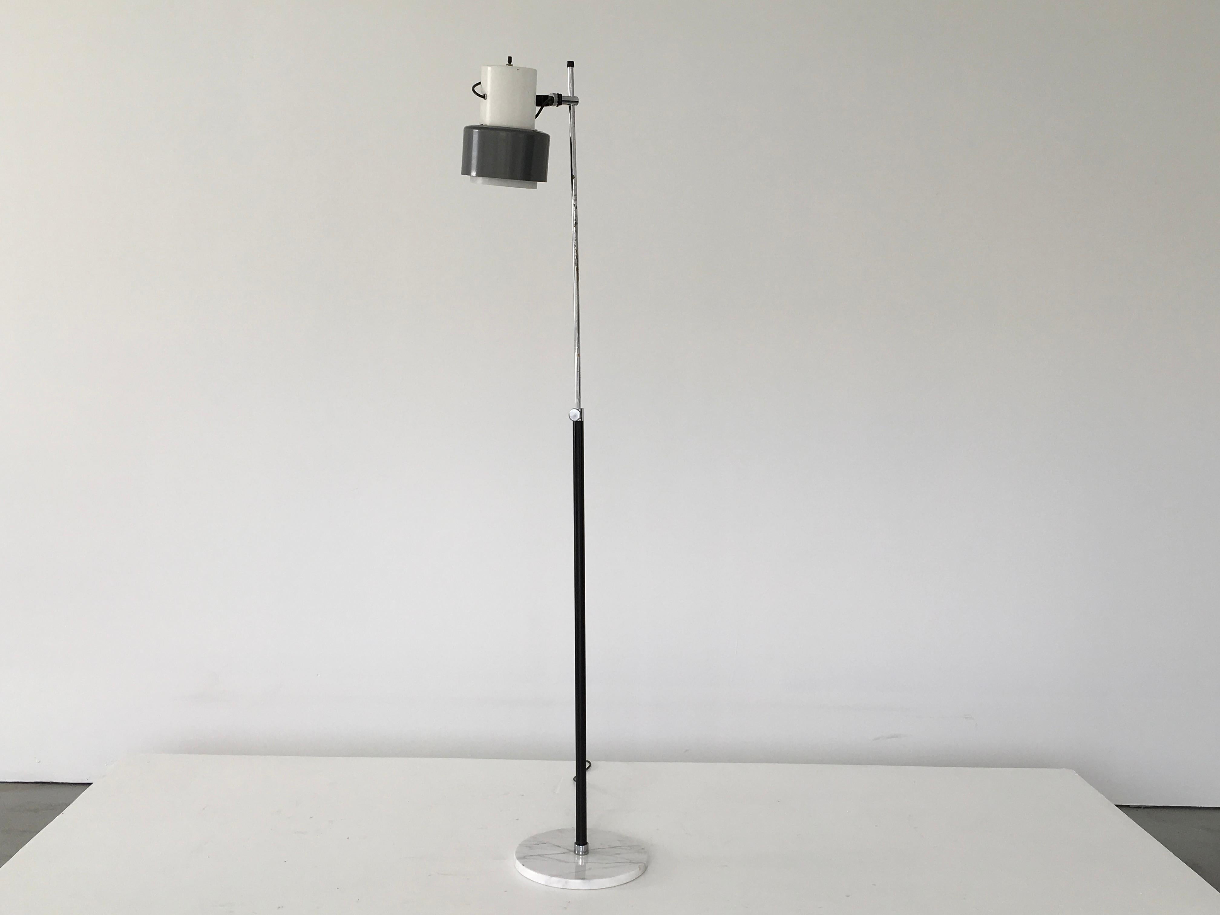 Arteluce floor lamp in grey and white. Adjustable and versatile.