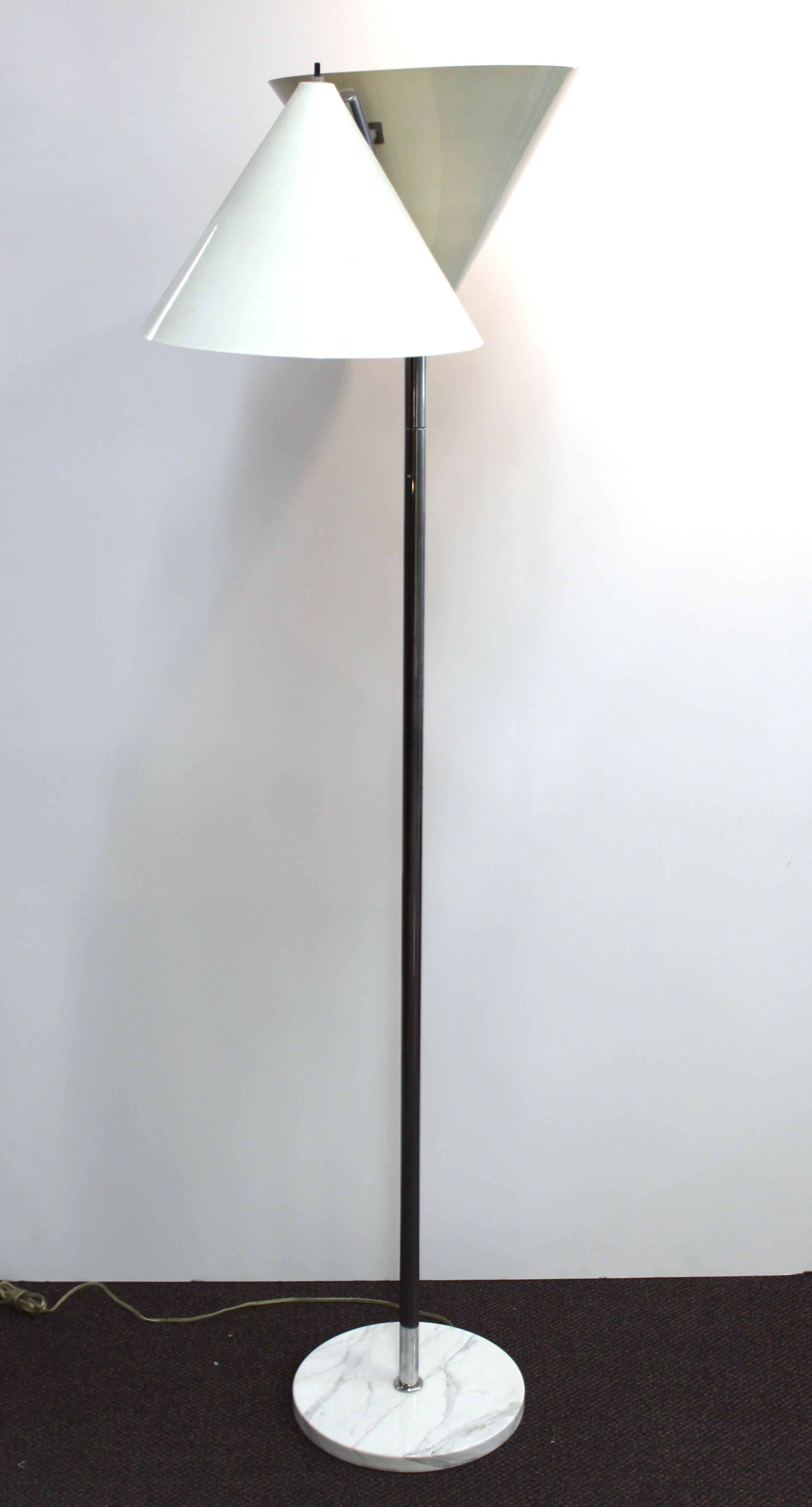 Italian modern floor lamp designed in the style of Arteluce, with two metal cone shades and a white veined circular marble base. The bottom is marked 'Made in Italy'. In great vintage condition with age-appropriate wear.