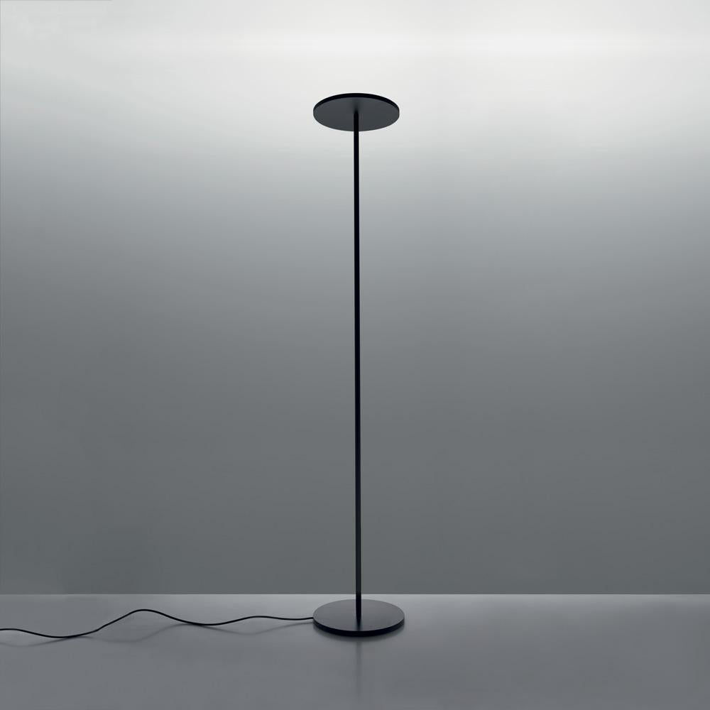 A minimally elegant floor lamp with indirect LED light diffusion, Athena is timeless and ideal for any environment or style. 

Twin black aluminum discs at the base and top are connected by a slender tubular stem standing at 6 feet tall.
