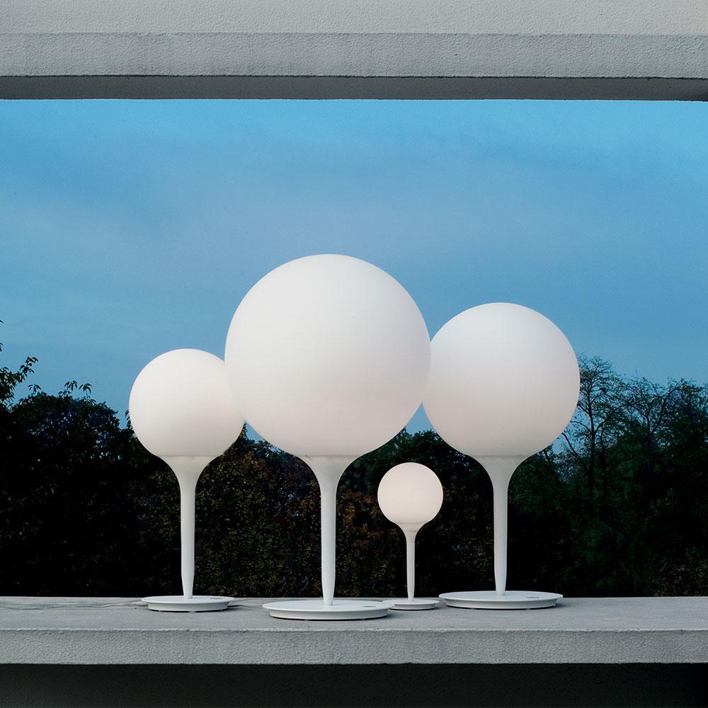 A spherical-shaped diffuser hand blown in opaque white glass is enhanced by a removable tapering stem which emits a soft glow. The stem is made of steel with tubing covered in polycarbonate sleeve. Available in table, floor and suspension with 2