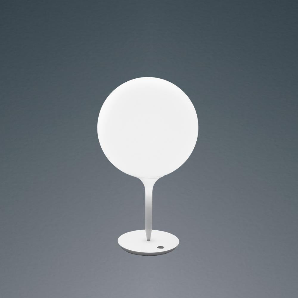 A spherical-shaped diffuser hand blown in opaque white glass is enhanced by a removable tapering stem which emits a soft glow. The stem is made of steel with tubing covered in polycarbonate sleeve. Available in table, floor and suspension with 2