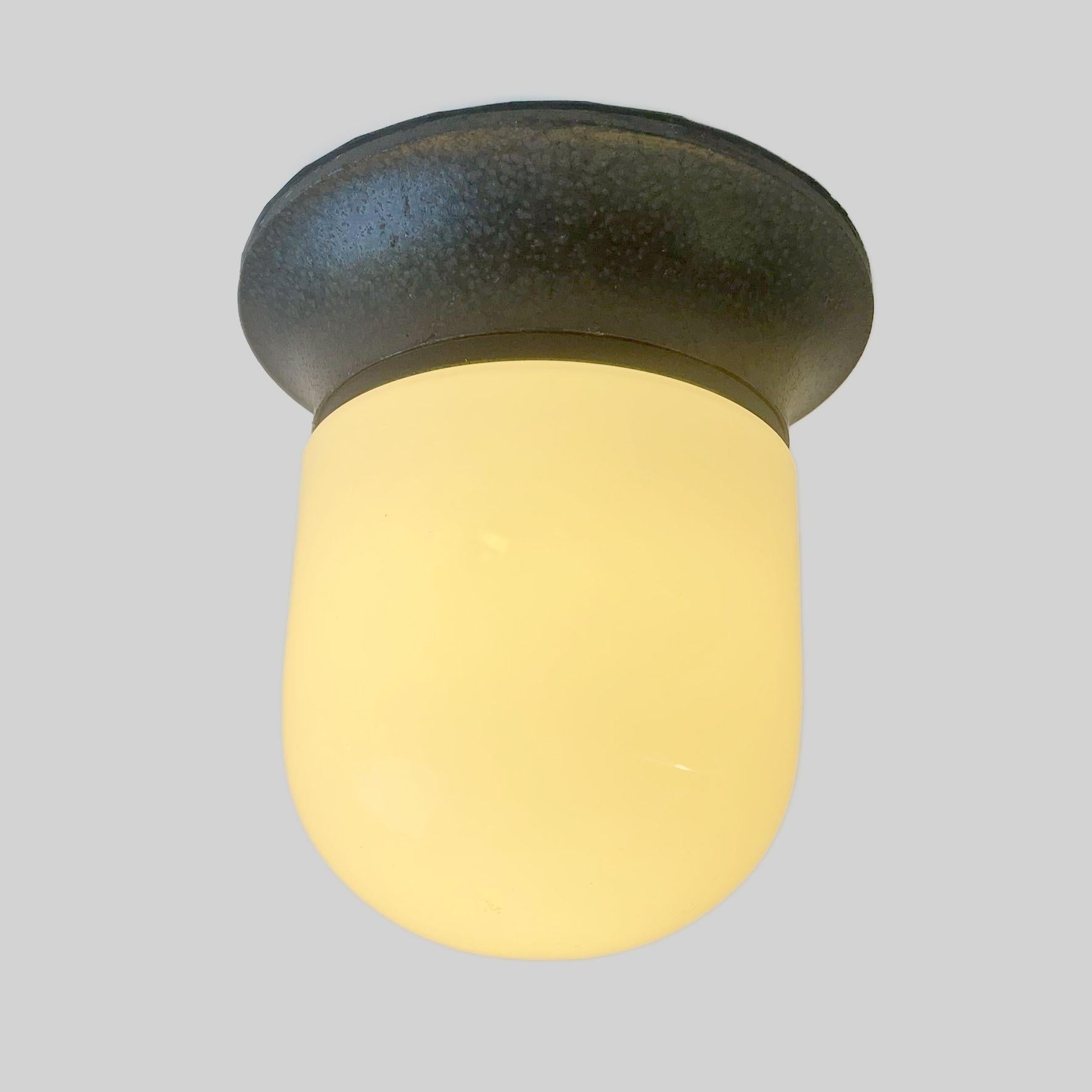 Early edition of the Illo ceiling or wall light, suitable for outdoor use. In good vintage condition. Designed by Sergio Mazza.