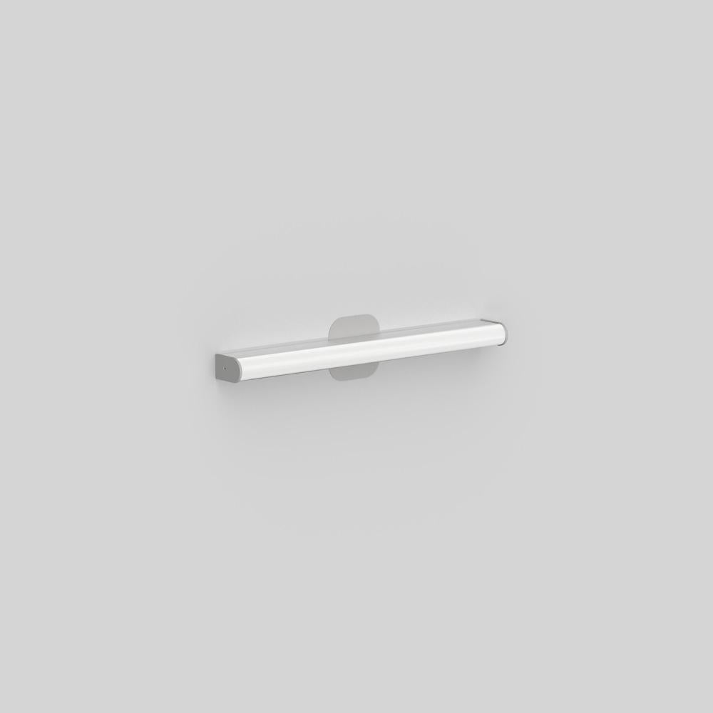Wall or ceiling mounted luminaire for indirect lighting with a square or rounded extruded aluminum, clear-coated finish. End caps powder-coated matte grey. 
Diffuser in extruded acrylic diffuser with opaque white finish. 

Canopy cover-plate matched