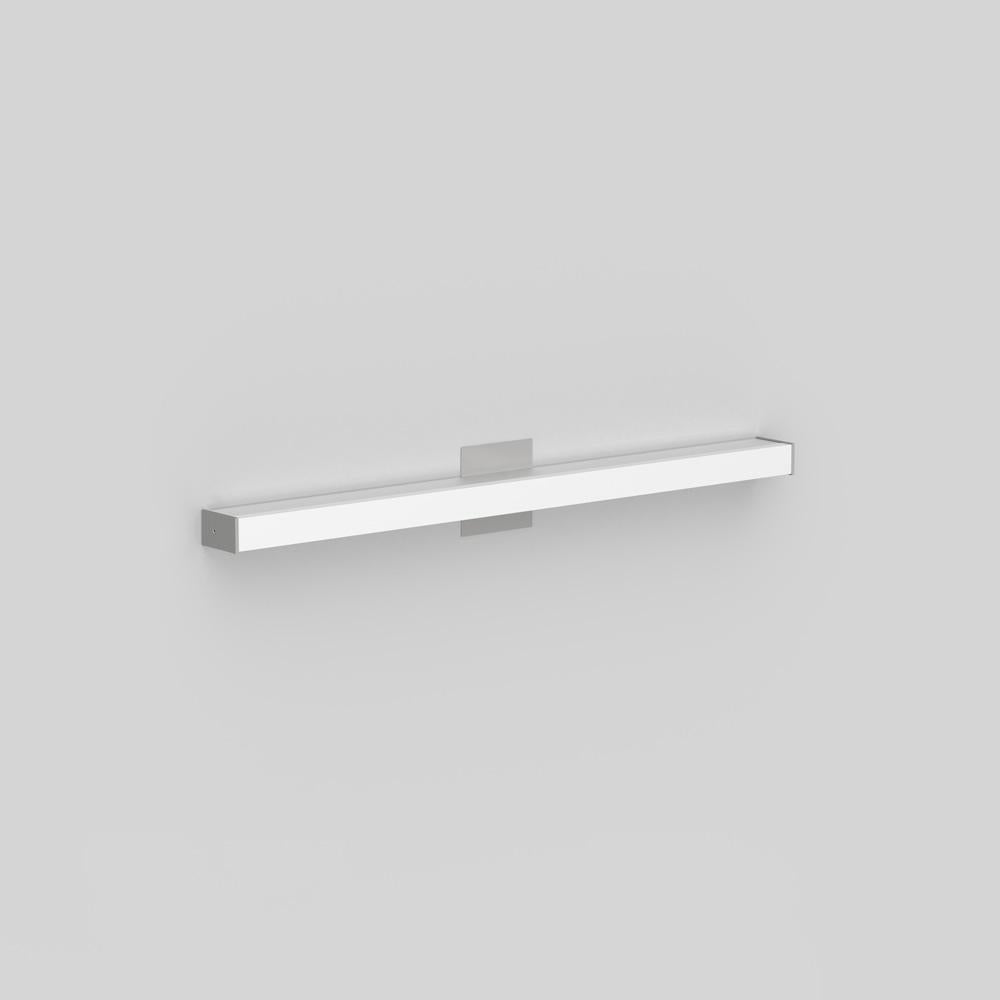 Wall or ceiling mounted luminaire for indirect lighting with a square or rounded extruded aluminum, clear-coated finish. End caps powder-coated matte grey. 
Diffuser in extruded acrylic diffuser with opaque white finish. 

Canopy cover-plate matched