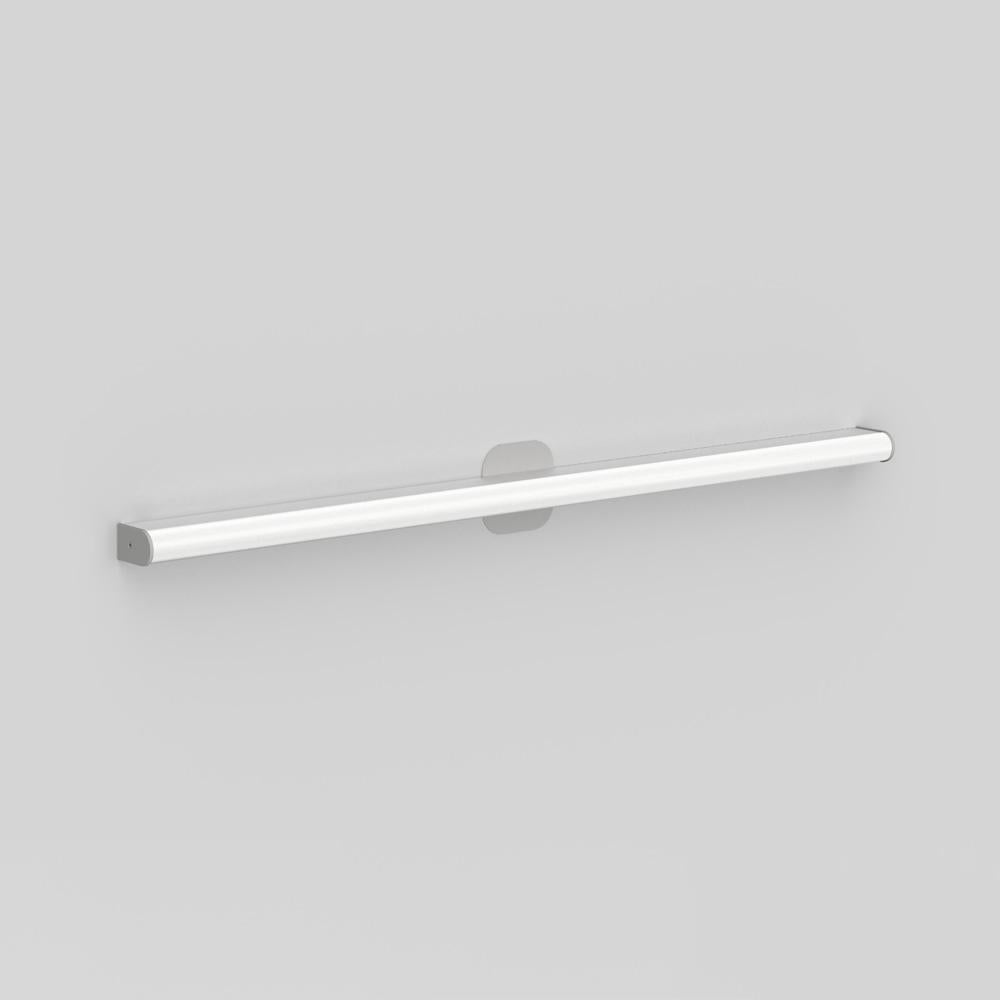 Wall or ceiling mounted luminaire for indirect lighting with a square or rounded extruded aluminium, clear-coated finish. End caps powder-coated matte grey. 
Diffuser in extruded acrylic diffuser with opaque white finish. 

Canopy cover-plate