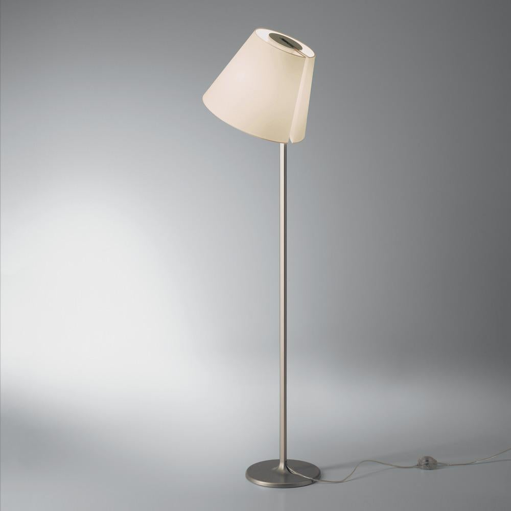 A silk satin fabric shade connected to a painted zamac base via a painted aluminum stem. Melampo can be adjusted for direct and indirect light. 

Mini accommodates 2 shade positions.
This item is currently only available in North America.