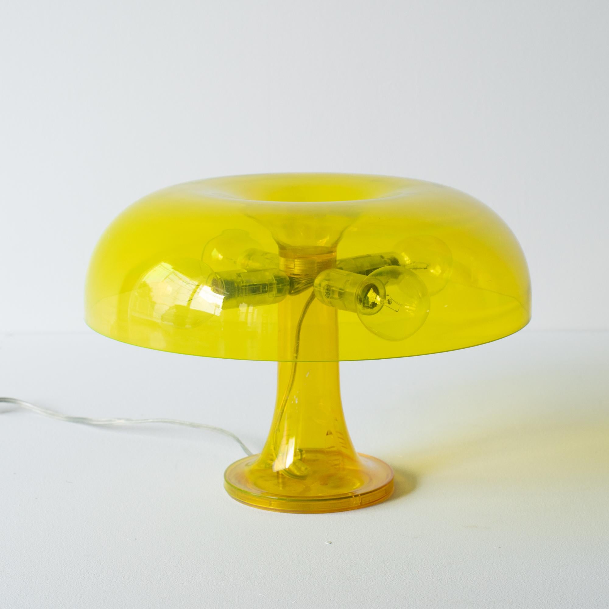 Masterpiece table lamp of Space Age design.Original was released from the 60s by Artemide.  It is transparent model released only from the late 90s until 2000s. It's improved design suitable for Y2K trend. This is highly valuable piece and iconic