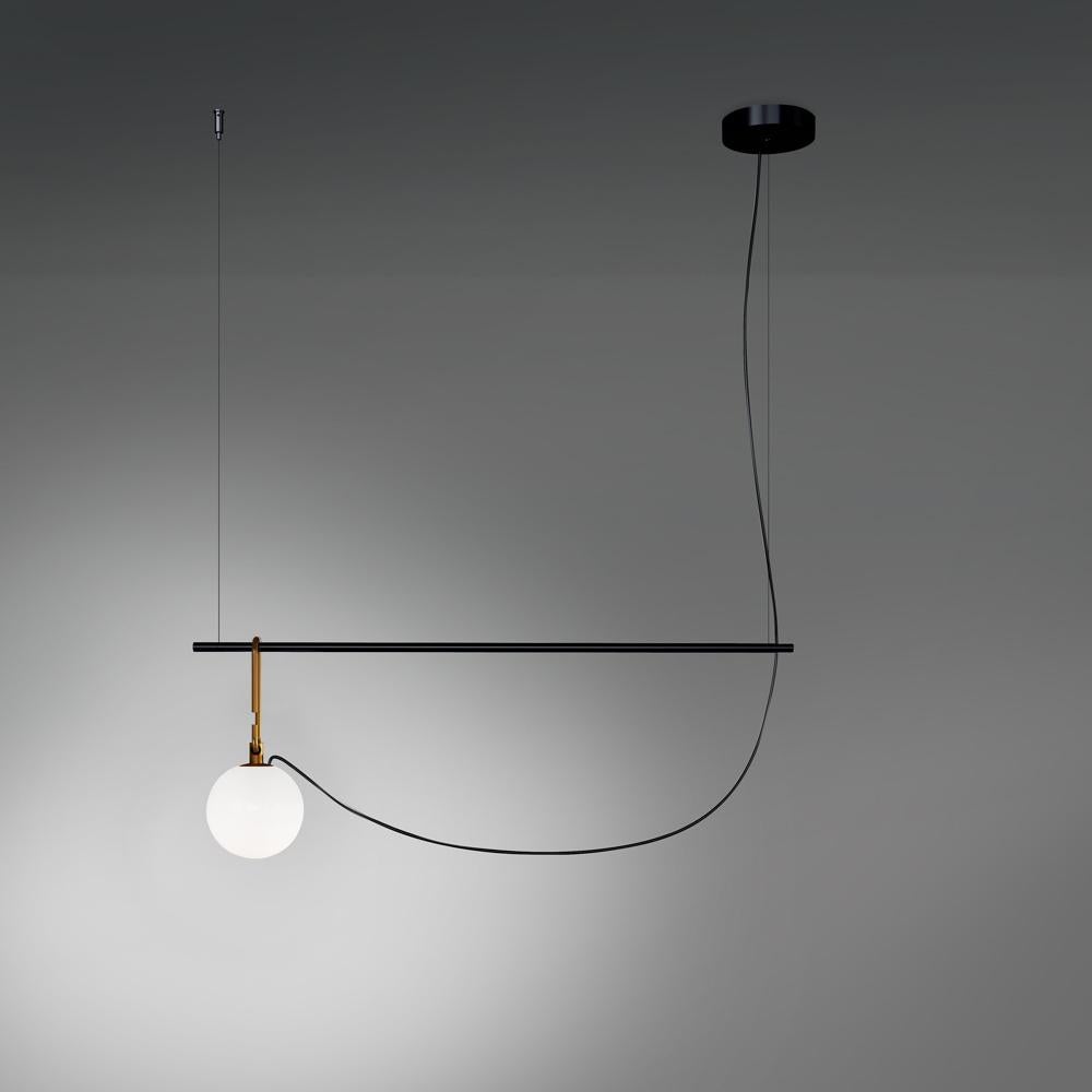 NH is a simple, versatile, practical appliance that can be laid or suspended. A white blown glass sphere slides along a brushed brass ring, which allows it to take different positions and to freely adjust and direct the diffuser. The frame becomes a