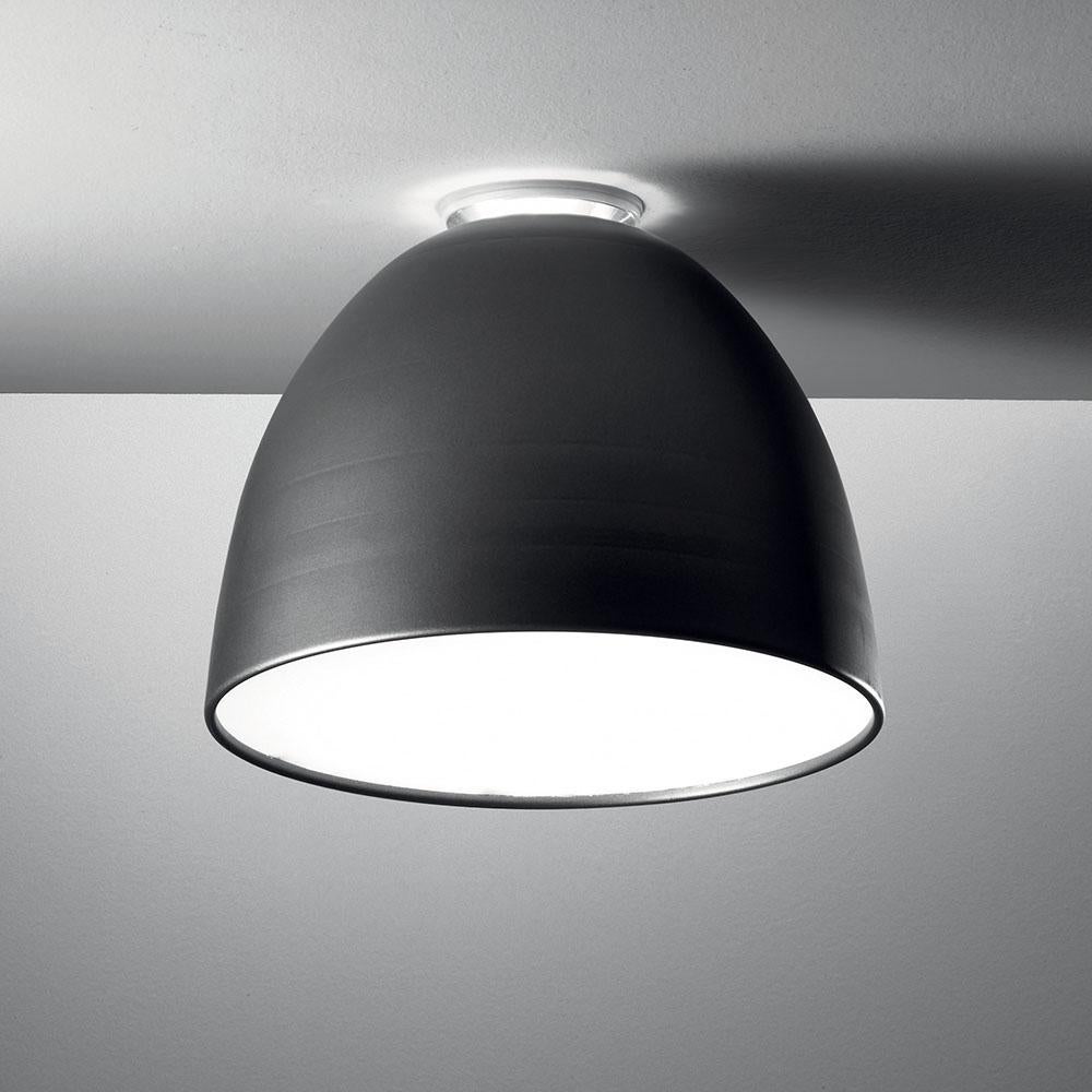 A system for the metamorphosis of light, Nur creates indirect light accompanied by a subtle “halo” effect on the ceiling. Aluminium molded body, polycarbonate lower diffuser, upper cap is transparent borosilicate glass. Nur ceiling is available in