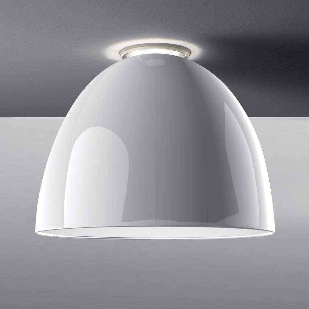 A system for the metamorphosis of light, Nur creates indirect light accompanied by a subtle “halo” effect on the ceiling. Aluminum molded body, polycarbonate lower diffuser, upper CAP is transparent borosilicate glass. Nur ceiling is available in