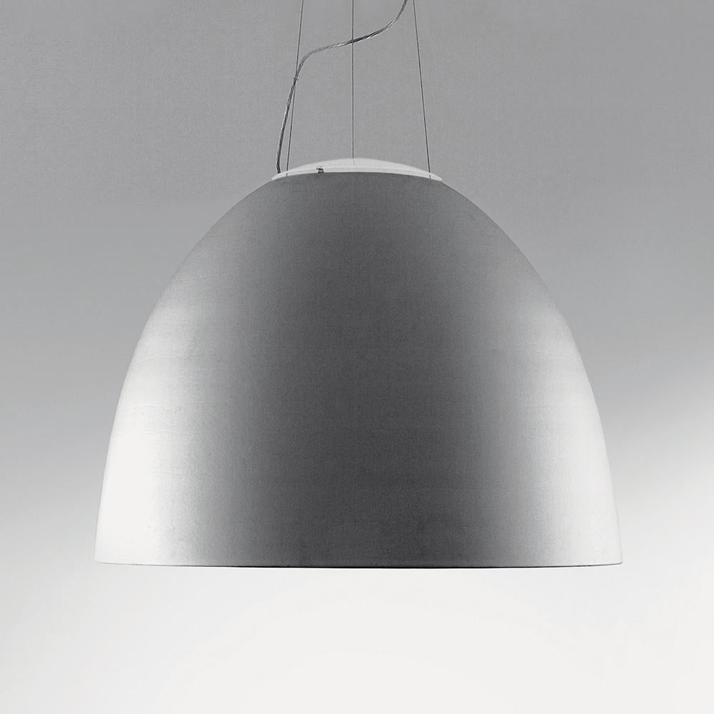 A system for the metamorphosis of light, Nur suspension has a sleek, contemporary dome shape that provides direct downlighting, with a sanded glass top that also allows a softer, more subtle diffused light to escape. Nur creates indirect light