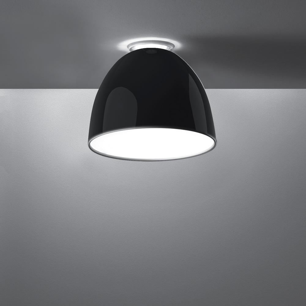 A system for the metamorphosis of light, Nur creates indirect light accompanied by a subtle “halo” effect on the ceiling.
Aluminum molded body, polycarbonate lower diffuser, upper cap is transparent borosilicate glass. 

Nur ceiling is available in