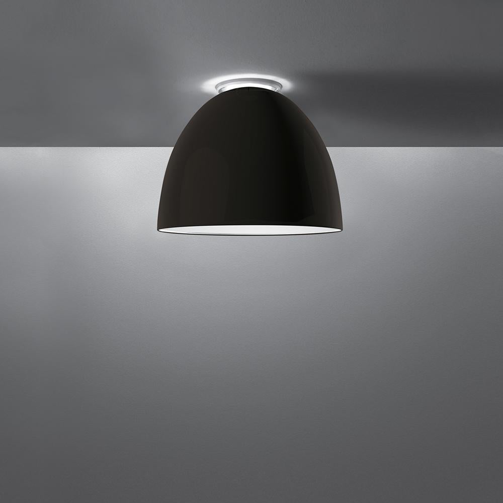 A system for the metamorphosis of light, Nur creates indirect light accompanied by a subtle “halo” effect on the ceiling. 
Aluminum molded body, polycarbonate lower diffuser, upper cap is transparent borosilicate glass. 

Nur ceiling is available in