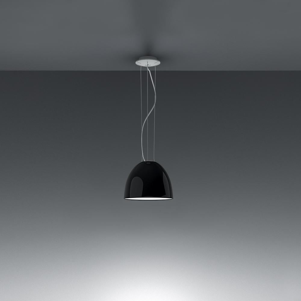 A system for the metamorphosis of light, Nur suspension has a sleek, contemporary dome shape that provides direct downlighting, with a sanded glass top that also allows a softer, more subtle diffused light to escape. 
Nur creates indirect light